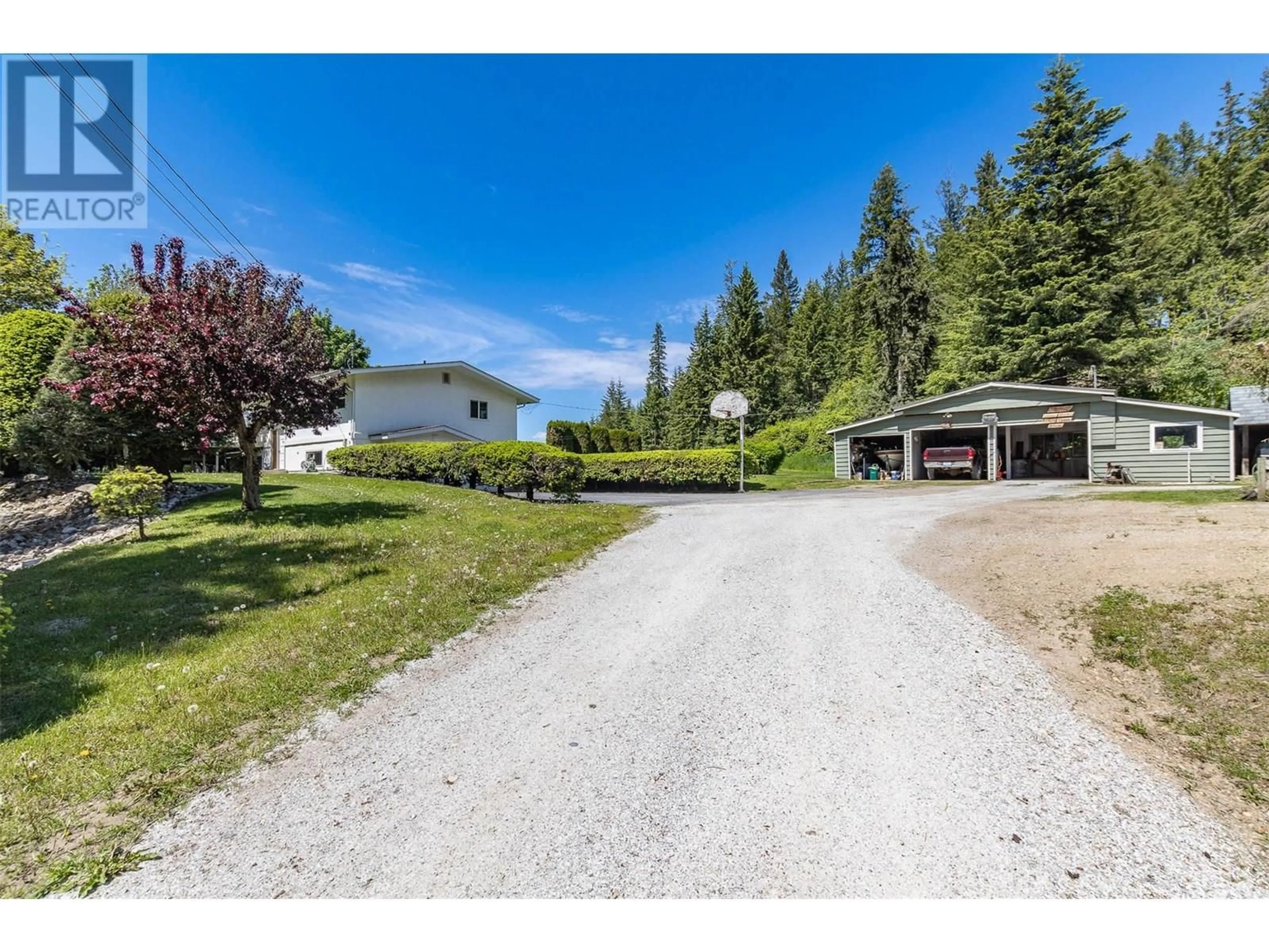 A pic from outside/outdoor area/front of a property/back of a property/a pic from drone, mountain view for 3851 10 AVENUE SOUTHEAST, Salmon Arm British Columbia V1E1W7