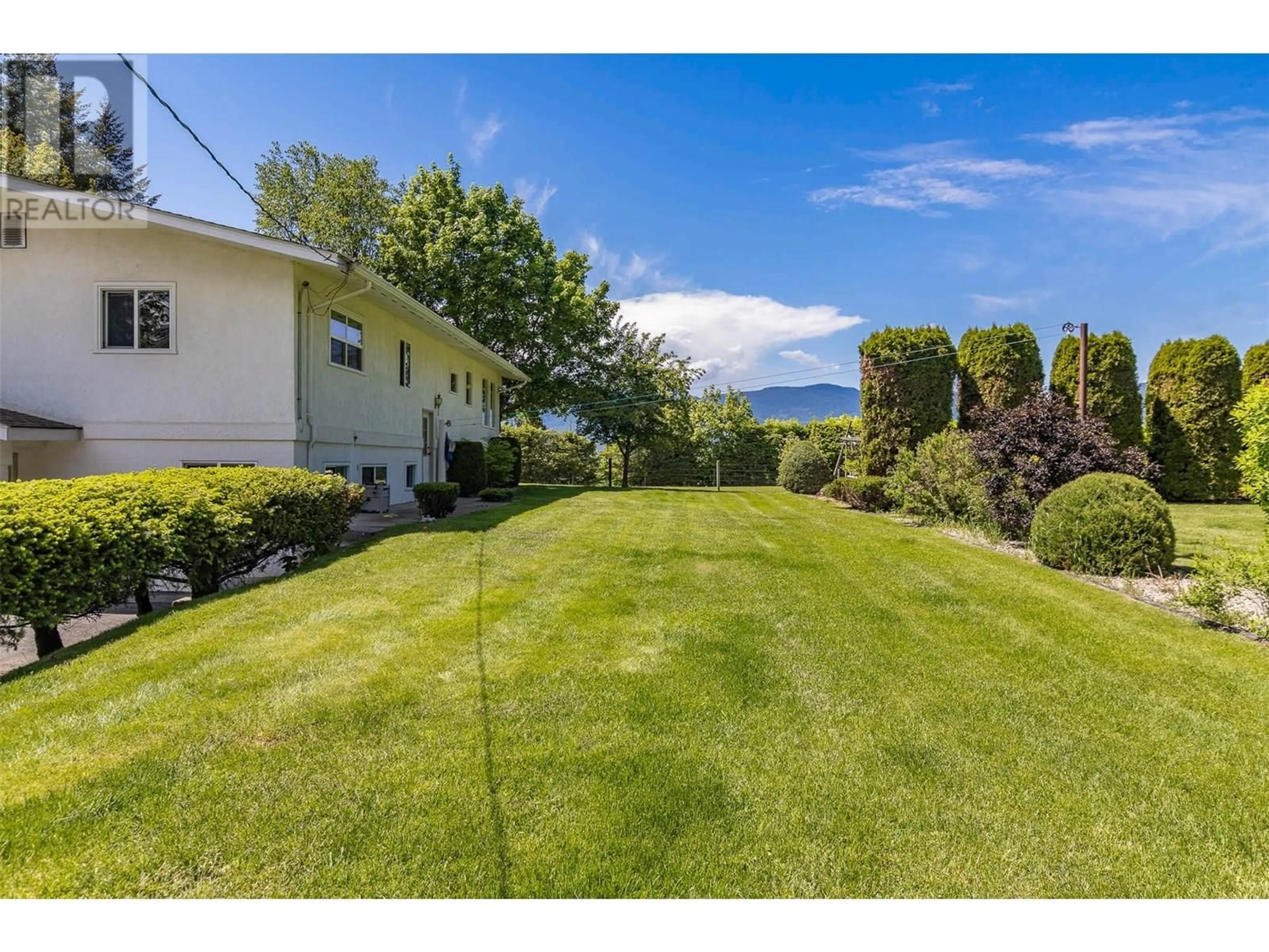 A pic from outside/outdoor area/front of a property/back of a property/a pic from drone, water/lake/river/ocean view for 3851 10 AVENUE SOUTHEAST, Salmon Arm British Columbia V1E1W7