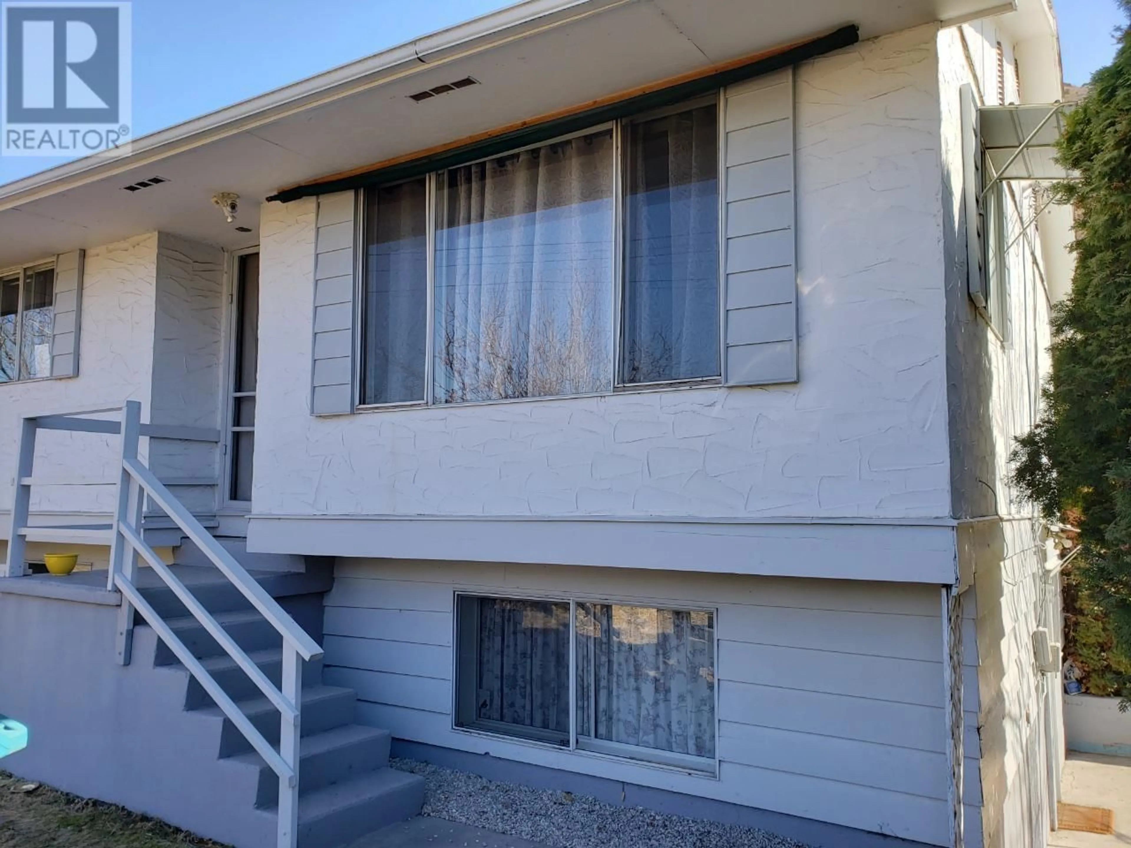 Home with vinyl exterior material, street for 100 BARNES STREET, Ashcroft British Columbia V0K1A0