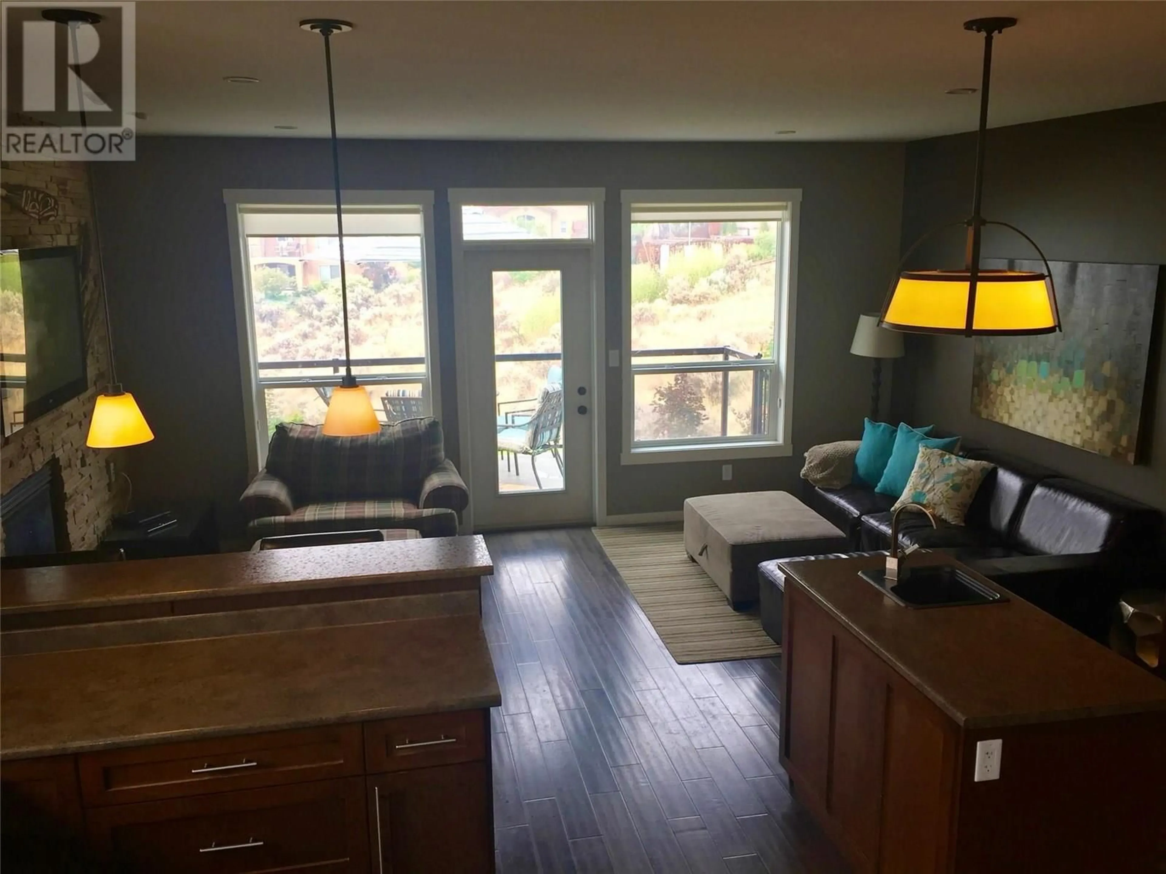 Living room with furniture, wood/laminate floor for 552 TRILLIUM DRIVE, Kamloops British Columbia V2H1R8