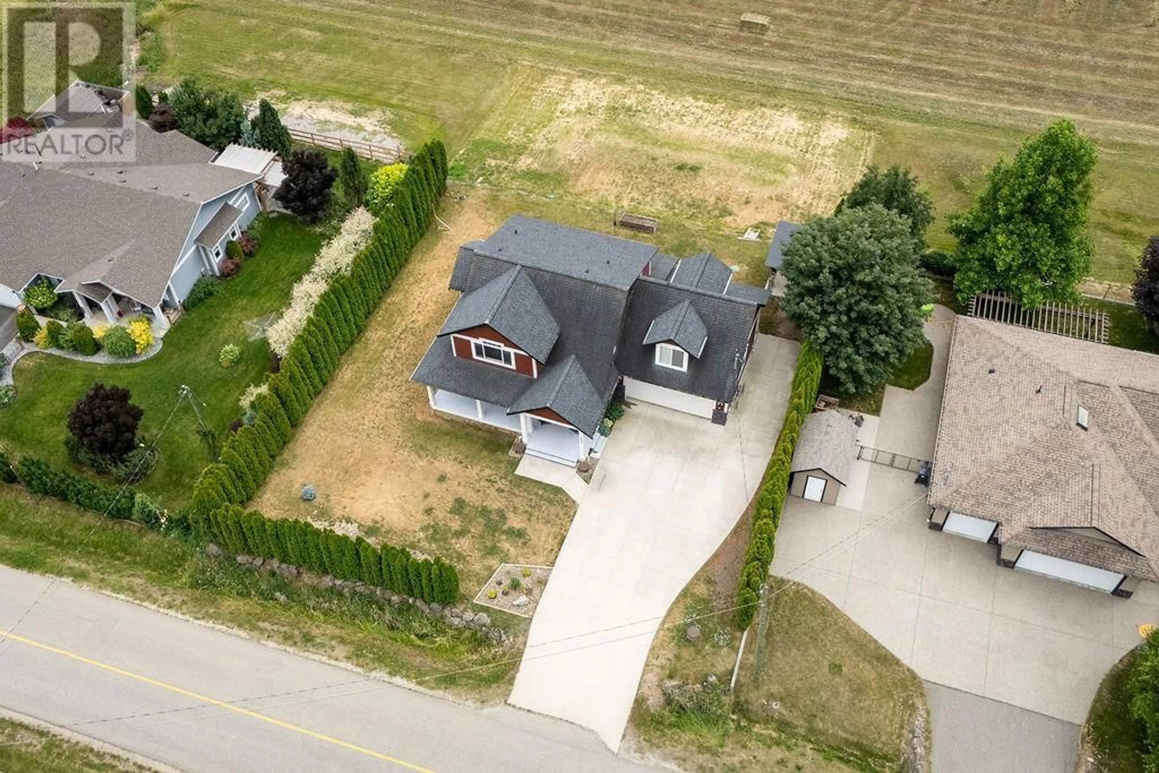 A pic from outside/outdoor area/front of a property/back of a property/a pic from drone, street for 4537 LANSDOWNE ROAD, Armstrong British Columbia V0E1B3
