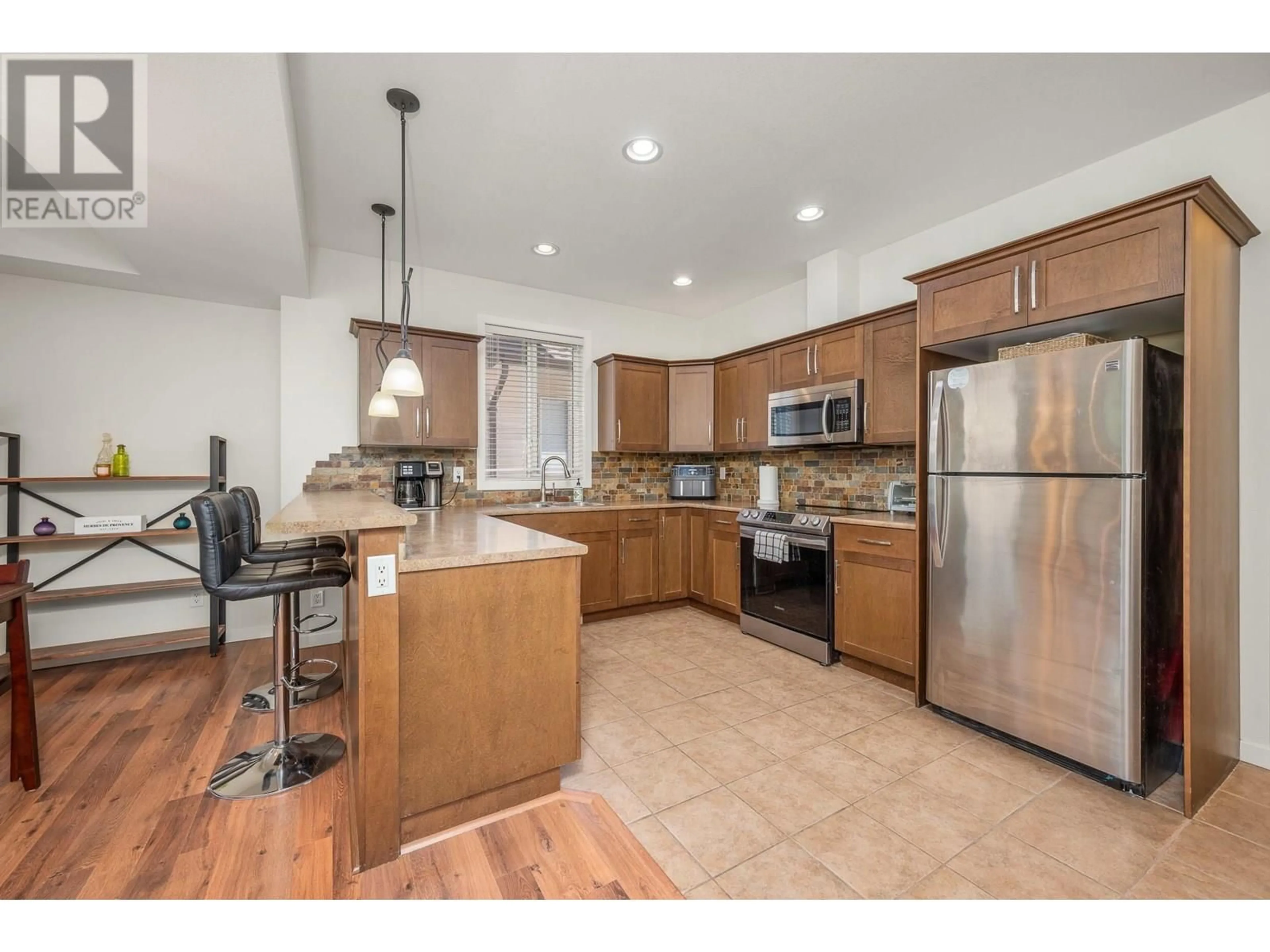 Open concept kitchen, ceramic/tile floor for 34 - 100 PALMER ROAD, Vernon British Columbia V1H2H8