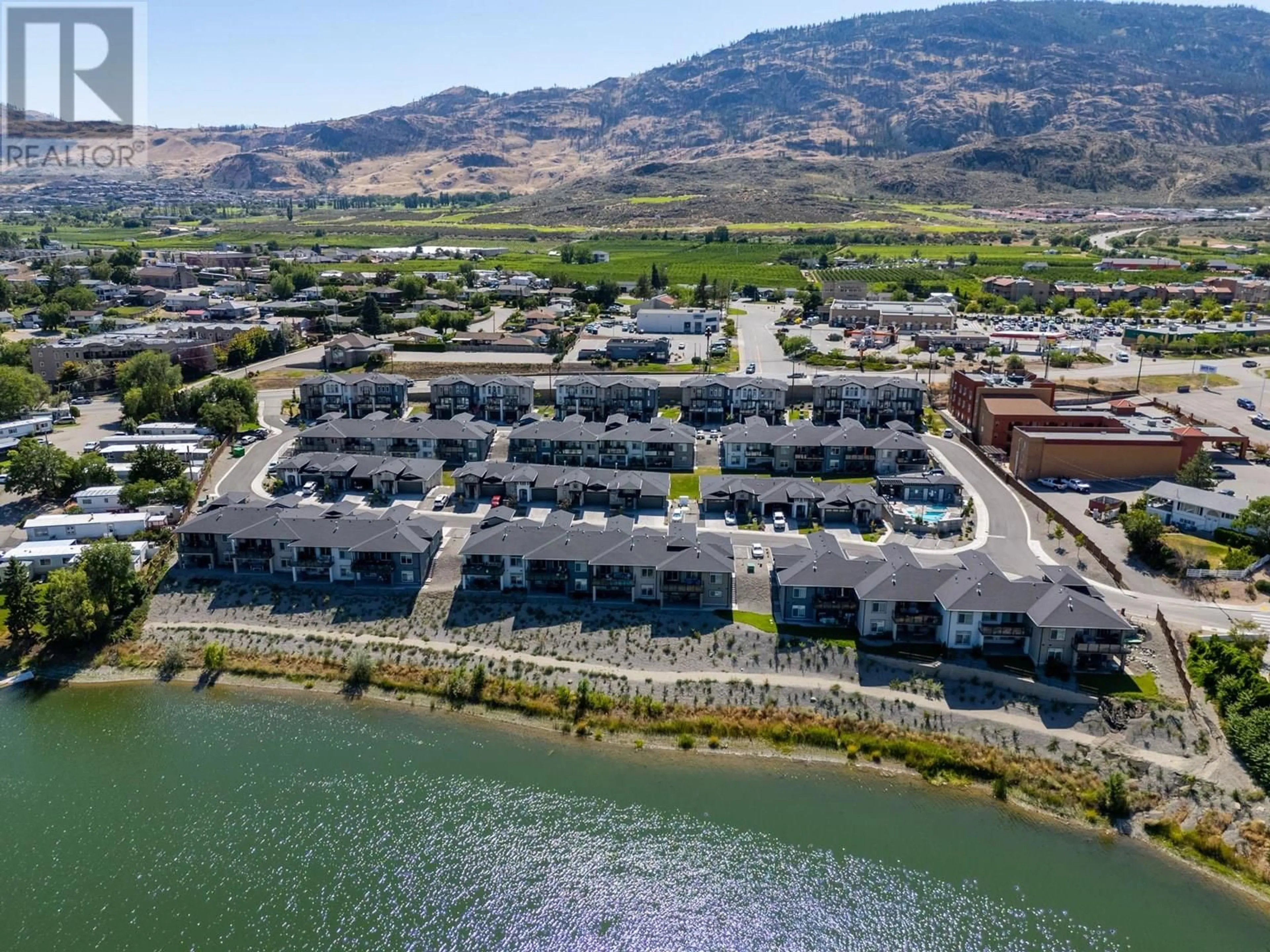 A pic from outside/outdoor area/front of a property/back of a property/a pic from drone, water/lake/river/ocean view for 48 - 8000 VEDETTE DRIVE, Osoyoos British Columbia V0H1V2