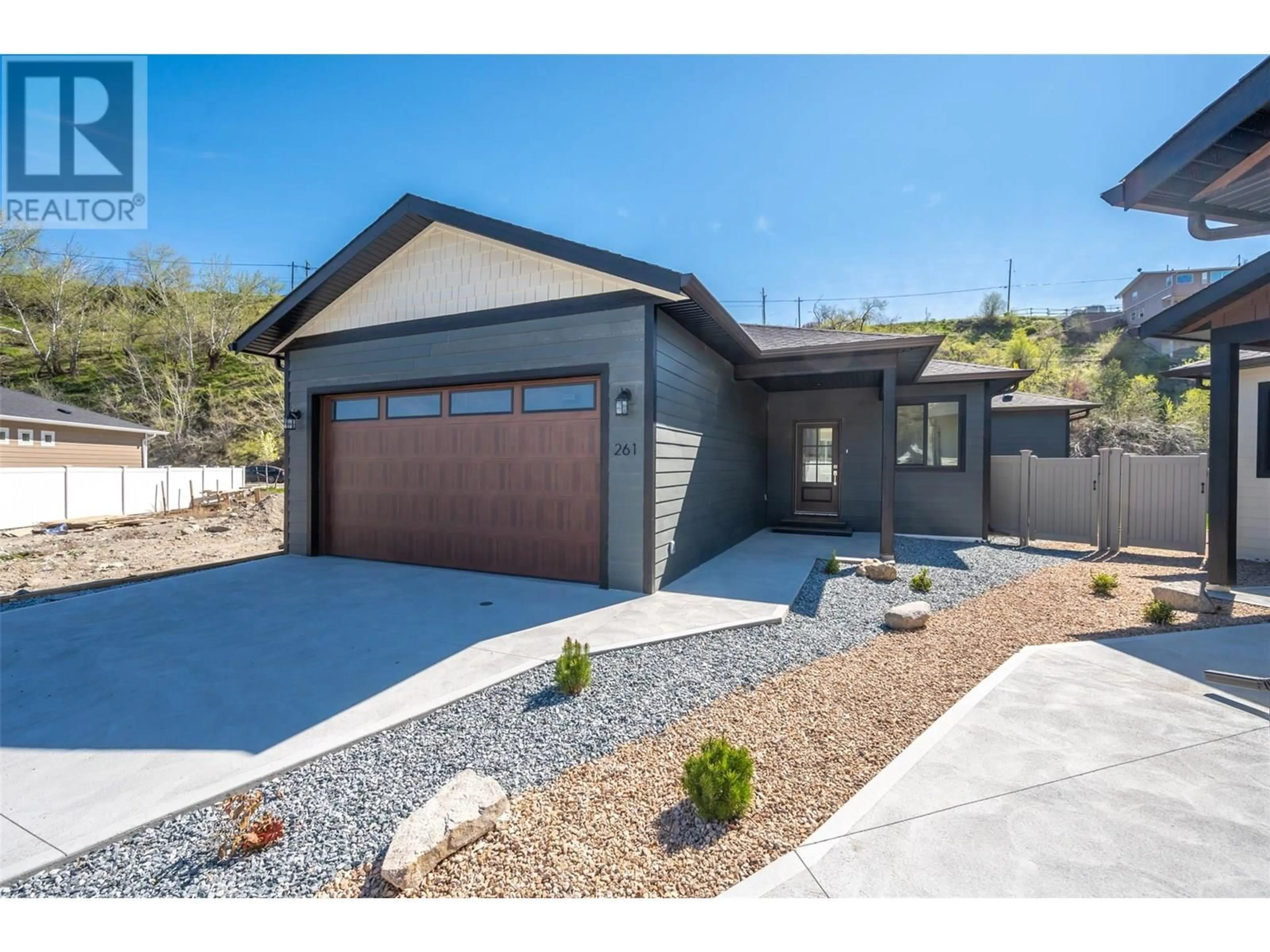 Home with vinyl exterior material, street for 261 BENTGRASS AVENUE, Oliver British Columbia V0H1T3