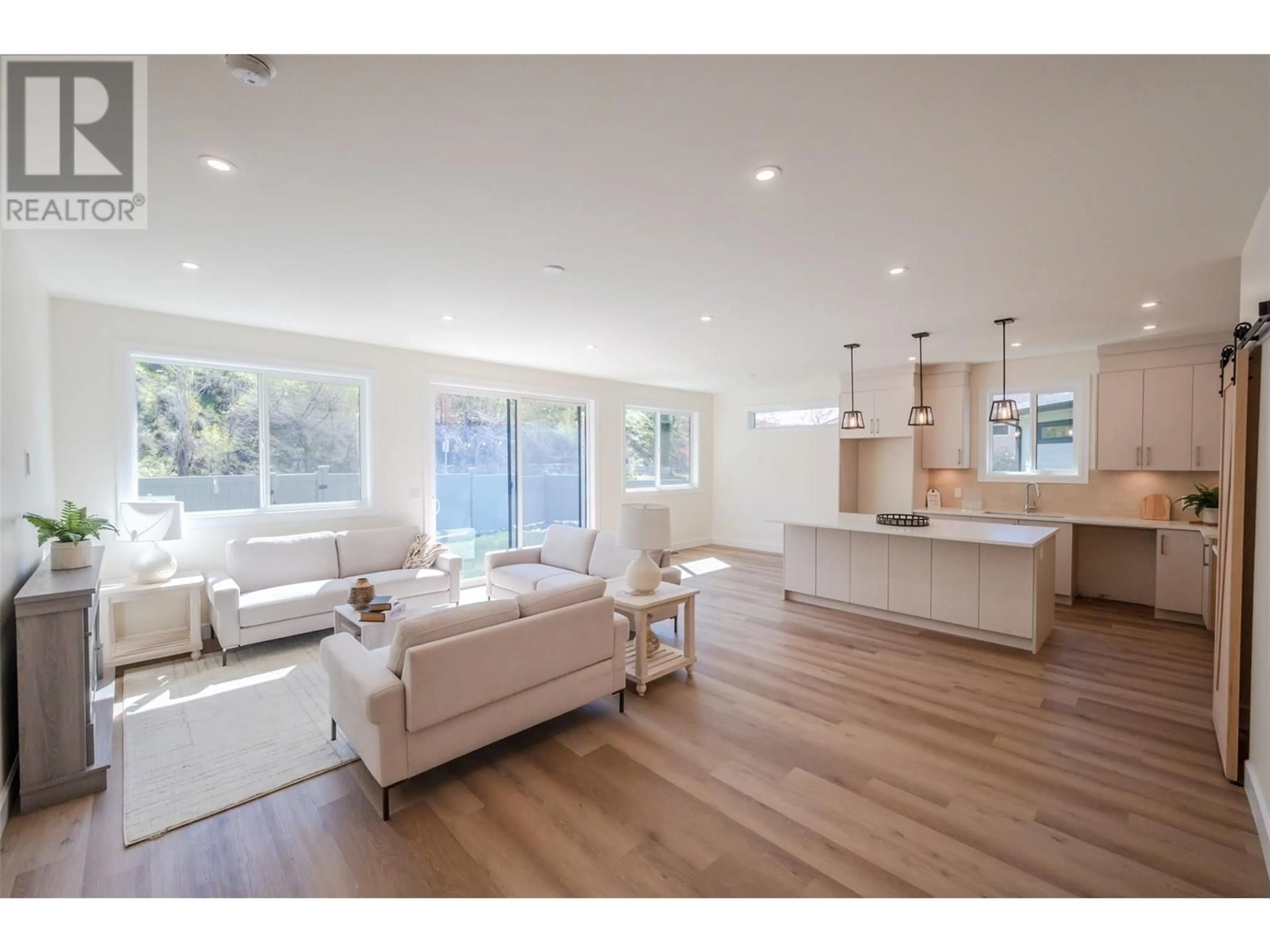 Open concept kitchen, wood/laminate floor for 261 BENTGRASS AVENUE, Oliver British Columbia V0H1T3