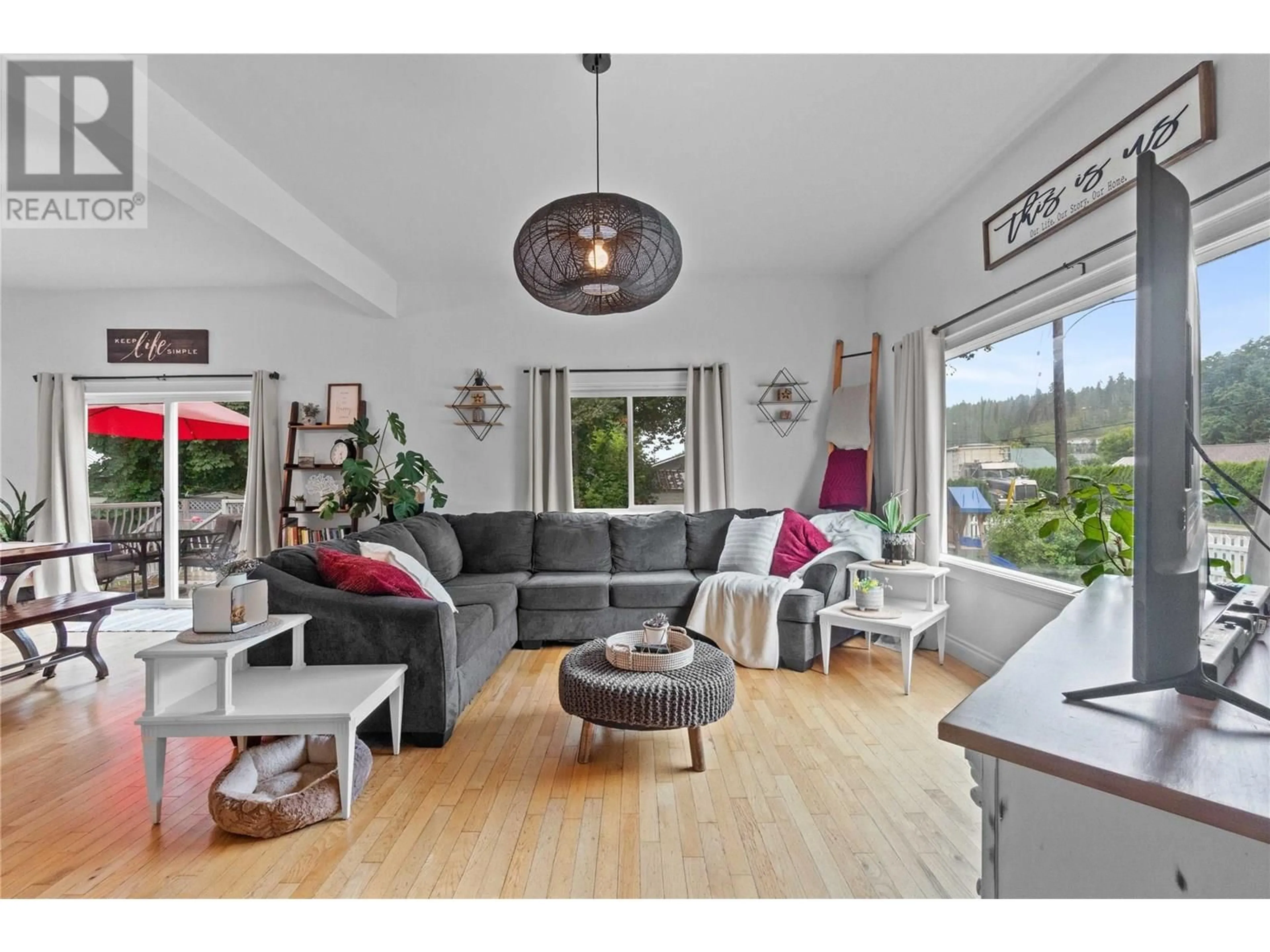 Living room with furniture, wood/laminate floor for 1207 GEORGE STREET, Enderby British Columbia V0E1V2