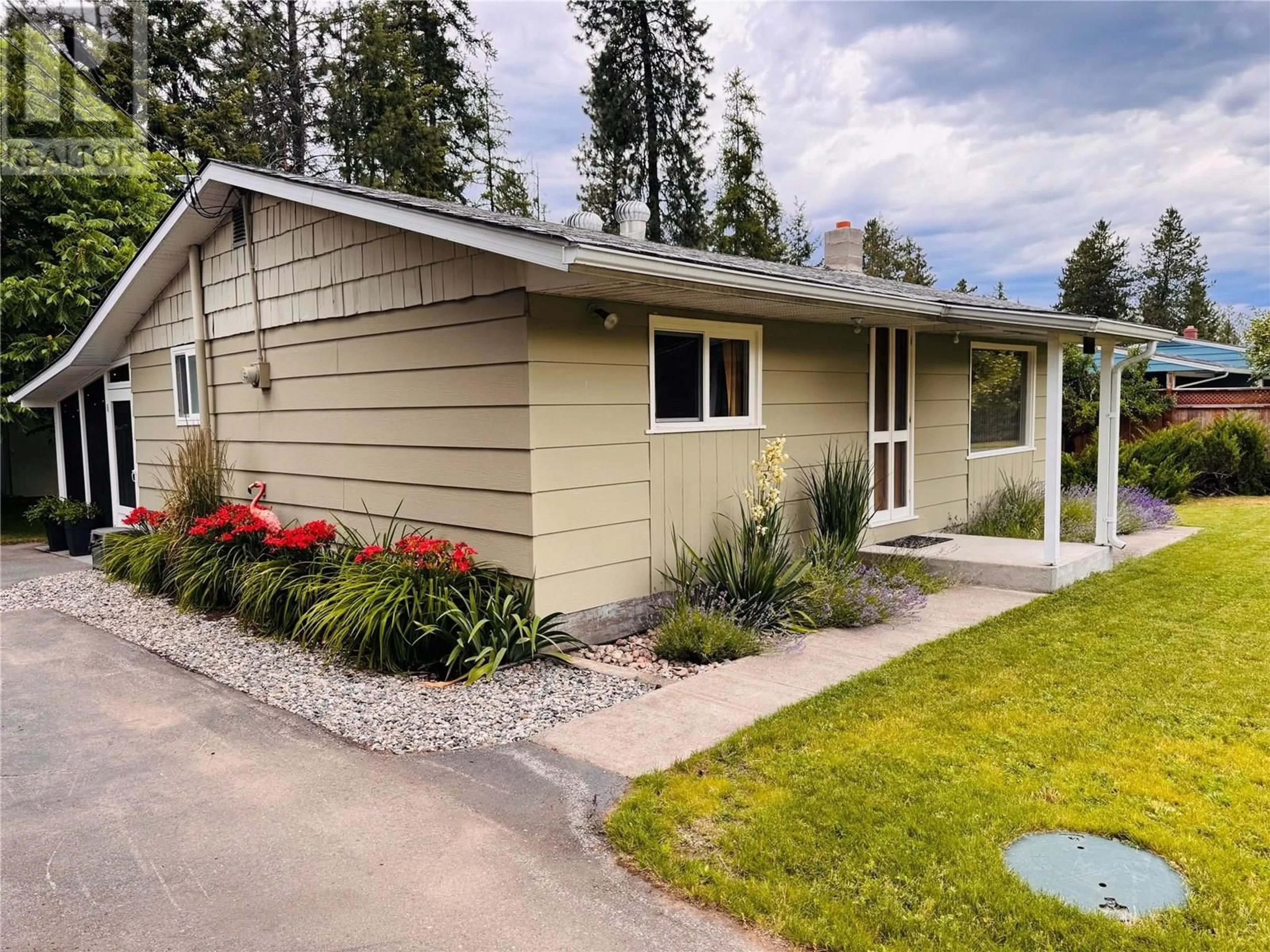 Home with vinyl exterior material, street for 1633 WOLVERTON ROAD, Christina Lake British Columbia V0H1E2