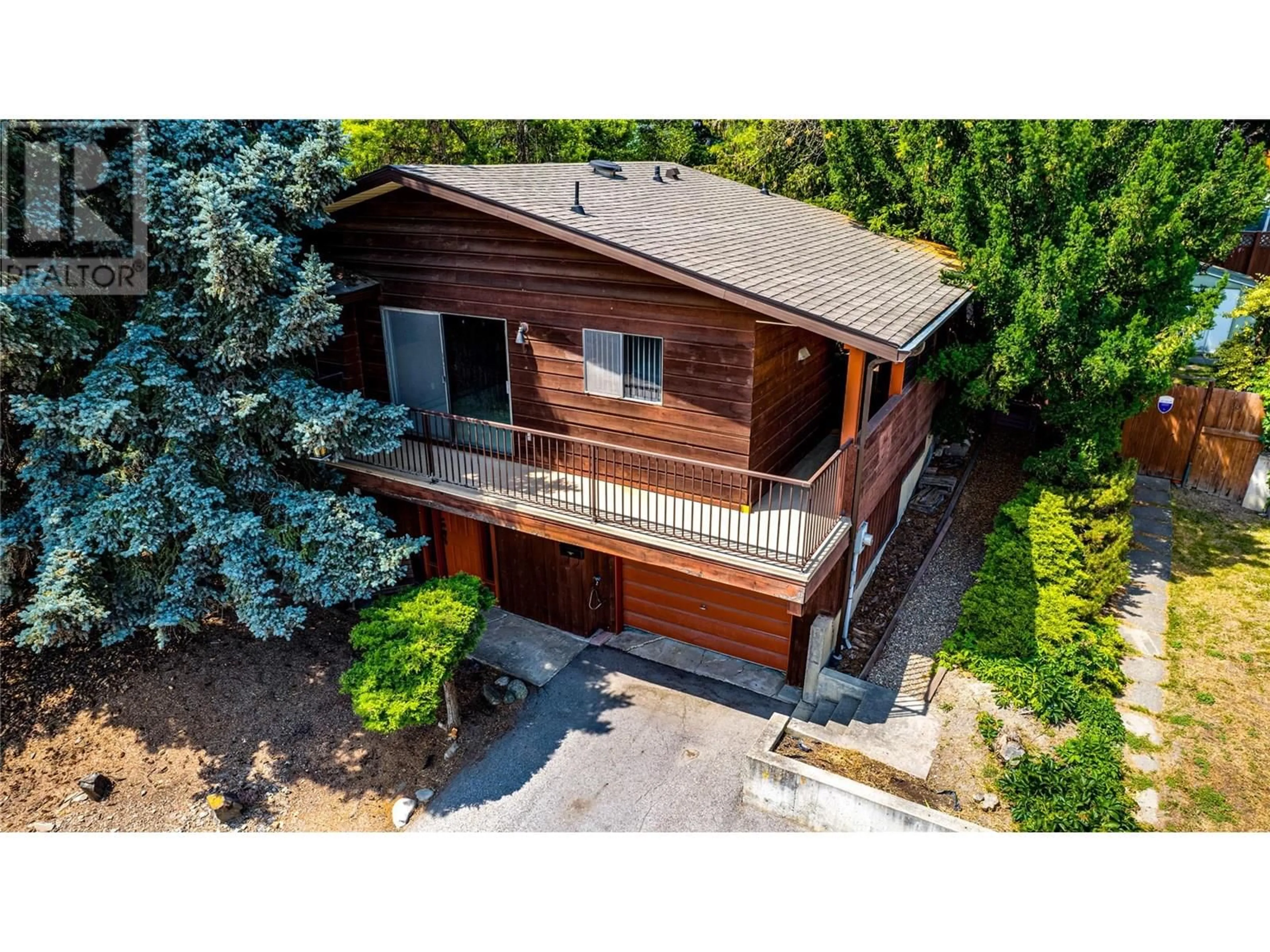 A pic from outside/outdoor area/front of a property/back of a property/a pic from drone, street for 3800 38 STREET, Vernon British Columbia V1T7L2