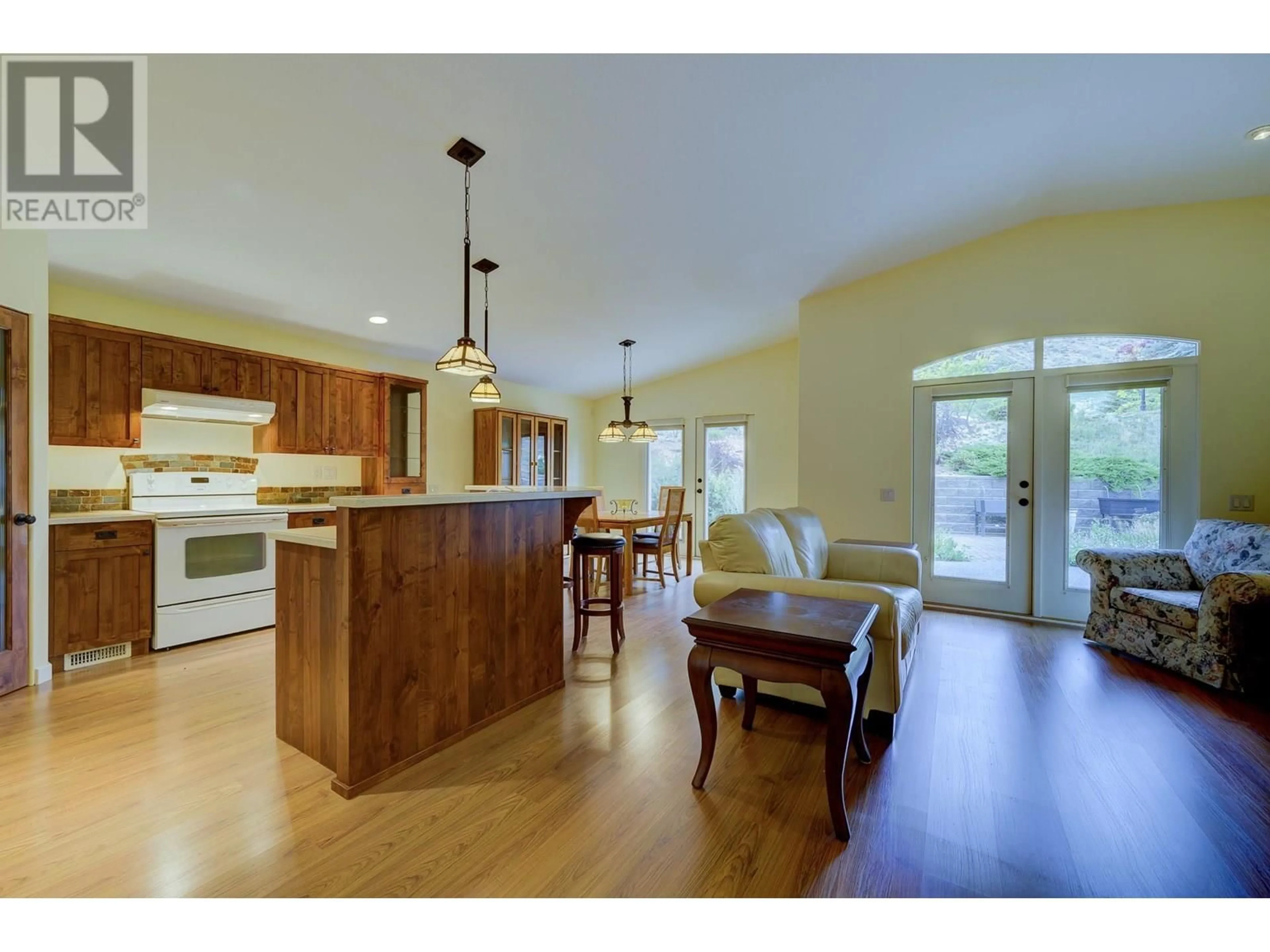 Open concept kitchen, wood/laminate floor for 604 ROSEWOOD LANE, Kamloops British Columbia V2H1T3