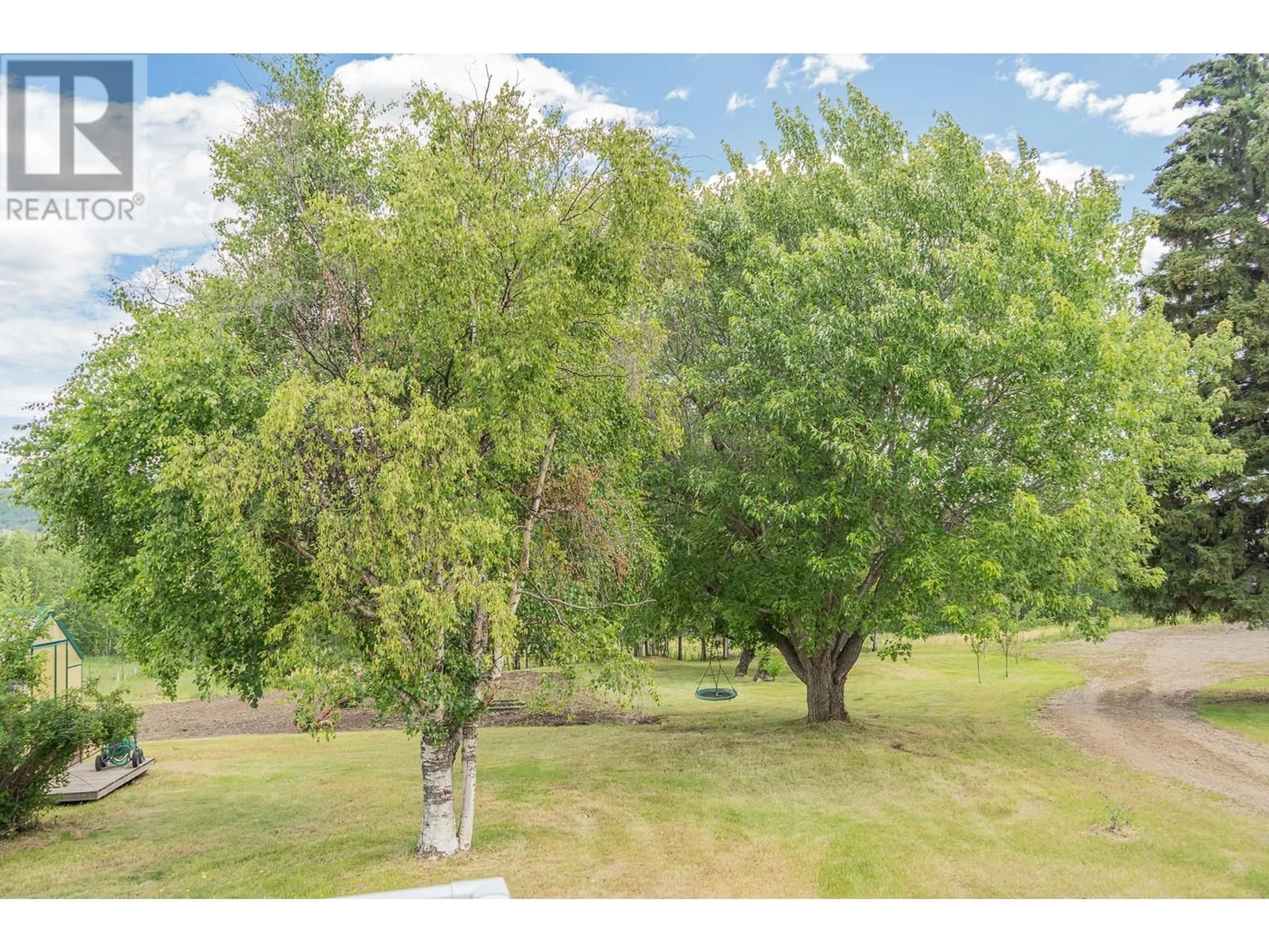 A pic from outside/outdoor area/front of a property/back of a property/a pic from drone, forest/trees view for 5105/5101 53 STREET, Pouce Coupe British Columbia V0C2C0