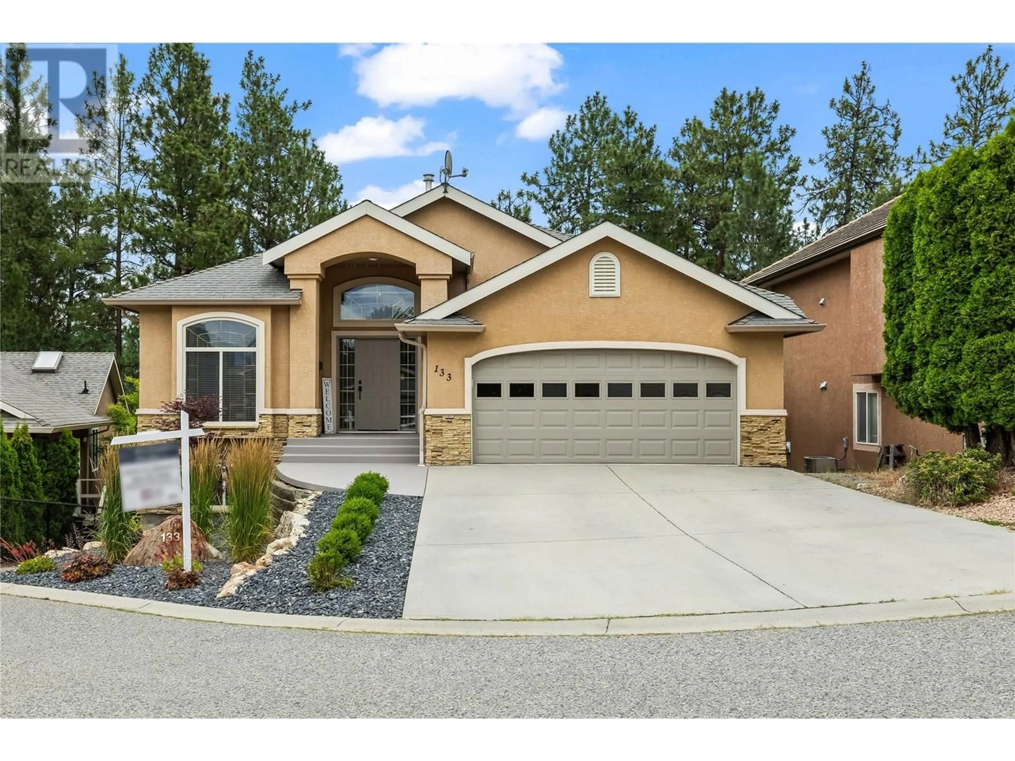 Home with brick exterior material, street for 133 - 2365 QUAIL RUN DRIVE, Kelowna British Columbia V1V2N5