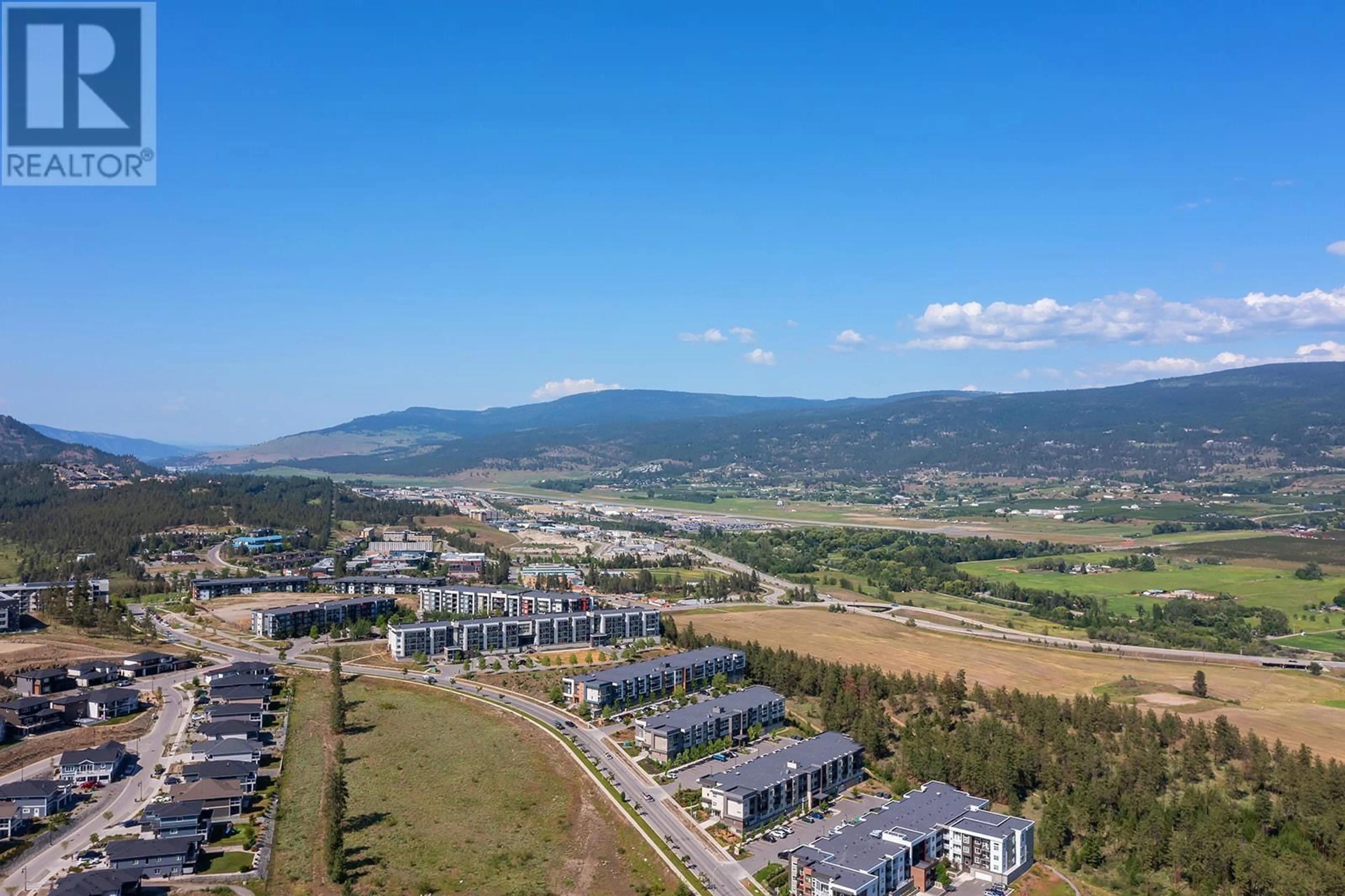 A pic from outside/outdoor area/front of a property/back of a property/a pic from drone, mountain view for PH12 - 655 ACADEMY WAY, Kelowna British Columbia V1V3A4