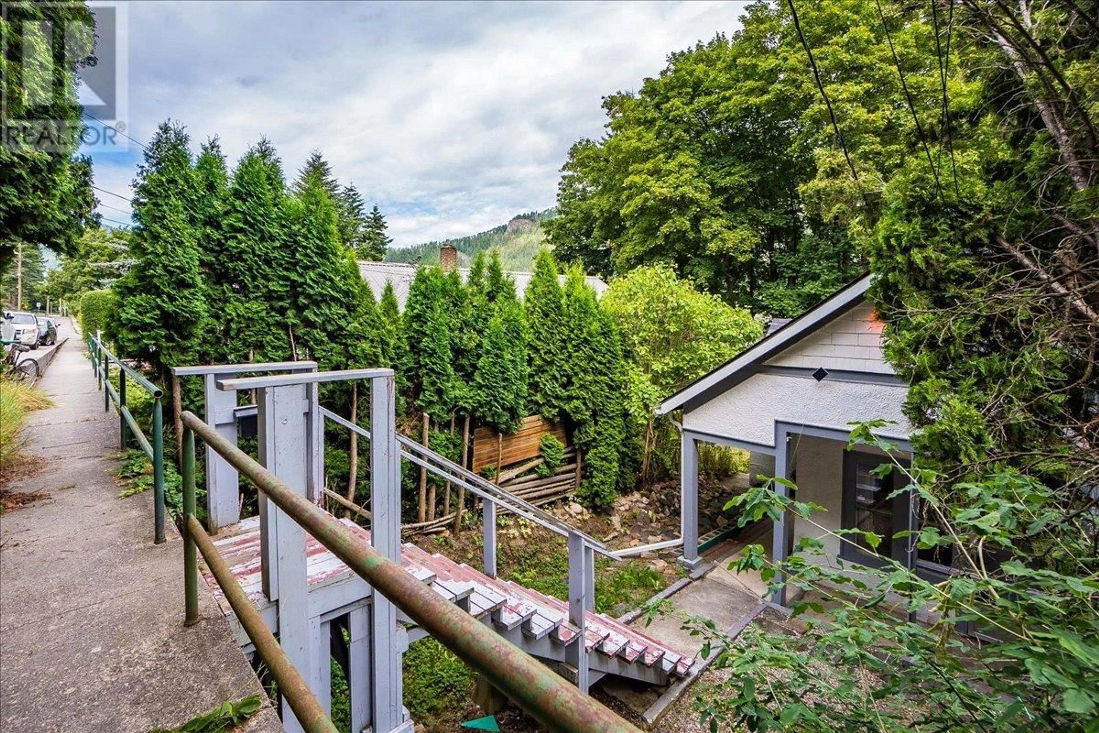 A pic from outside/outdoor area/front of a property/back of a property/a pic from drone, forest/trees view for 91 HIGH STREET, Nelson British Columbia V1L3Z5