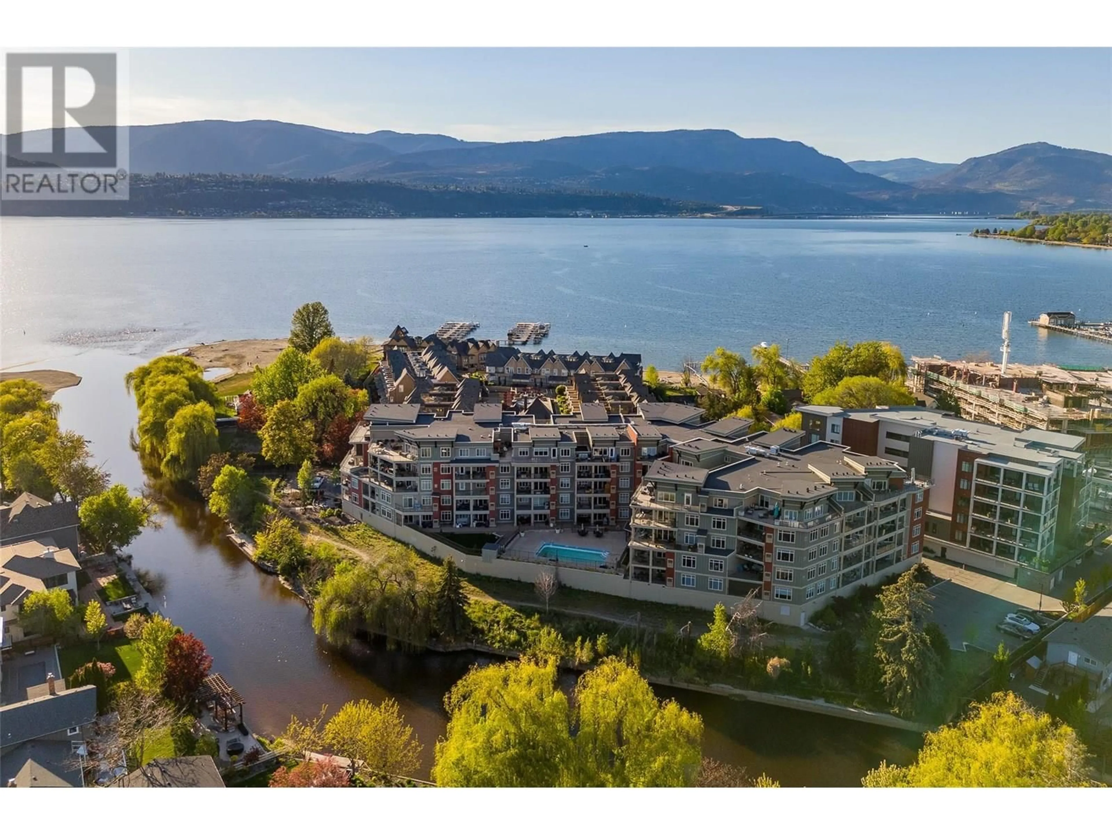 A pic from outside/outdoor area/front of a property/back of a property/a pic from drone, water/lake/river/ocean view for 204 - 3865 TRUSWELL ROAD, Kelowna British Columbia V1W3K9