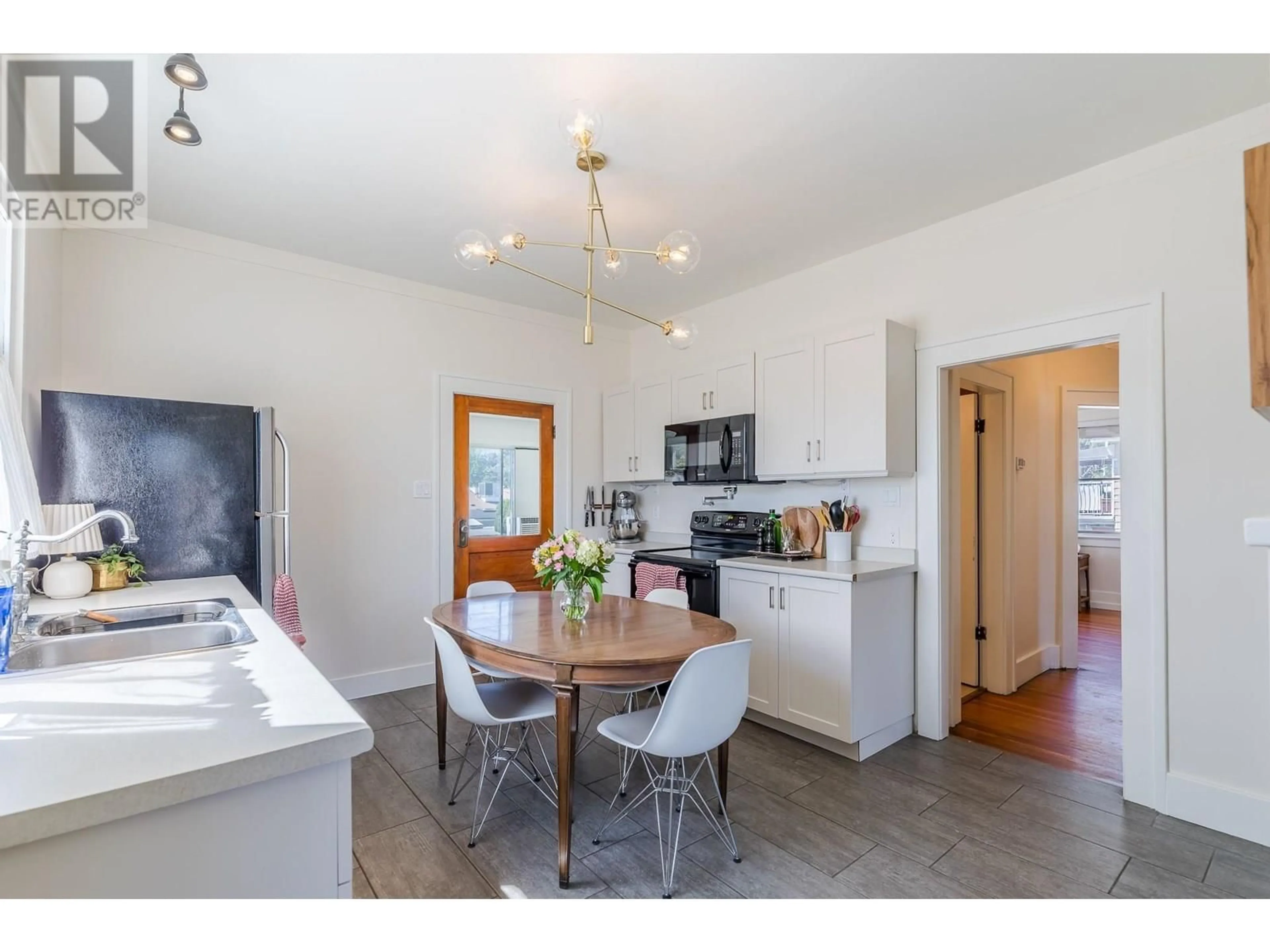 Open concept kitchen, wood/laminate floor for 11915 QUINPOOL ROAD, Summerland British Columbia V0H1Z5