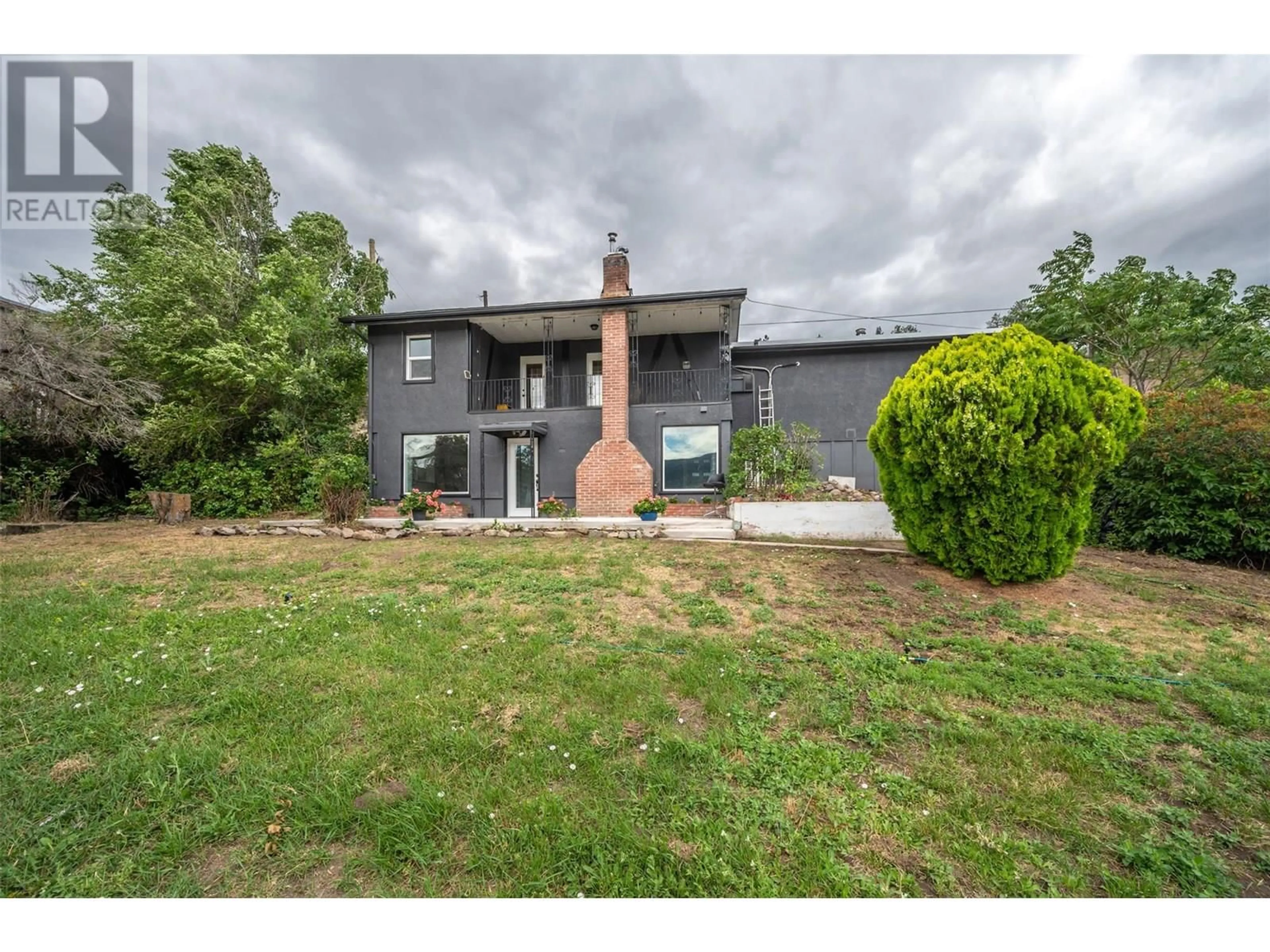 A pic from outside/outdoor area/front of a property/back of a property/a pic from drone, building for 100 LARCH AVENUE, Kaleden British Columbia V0H1K0