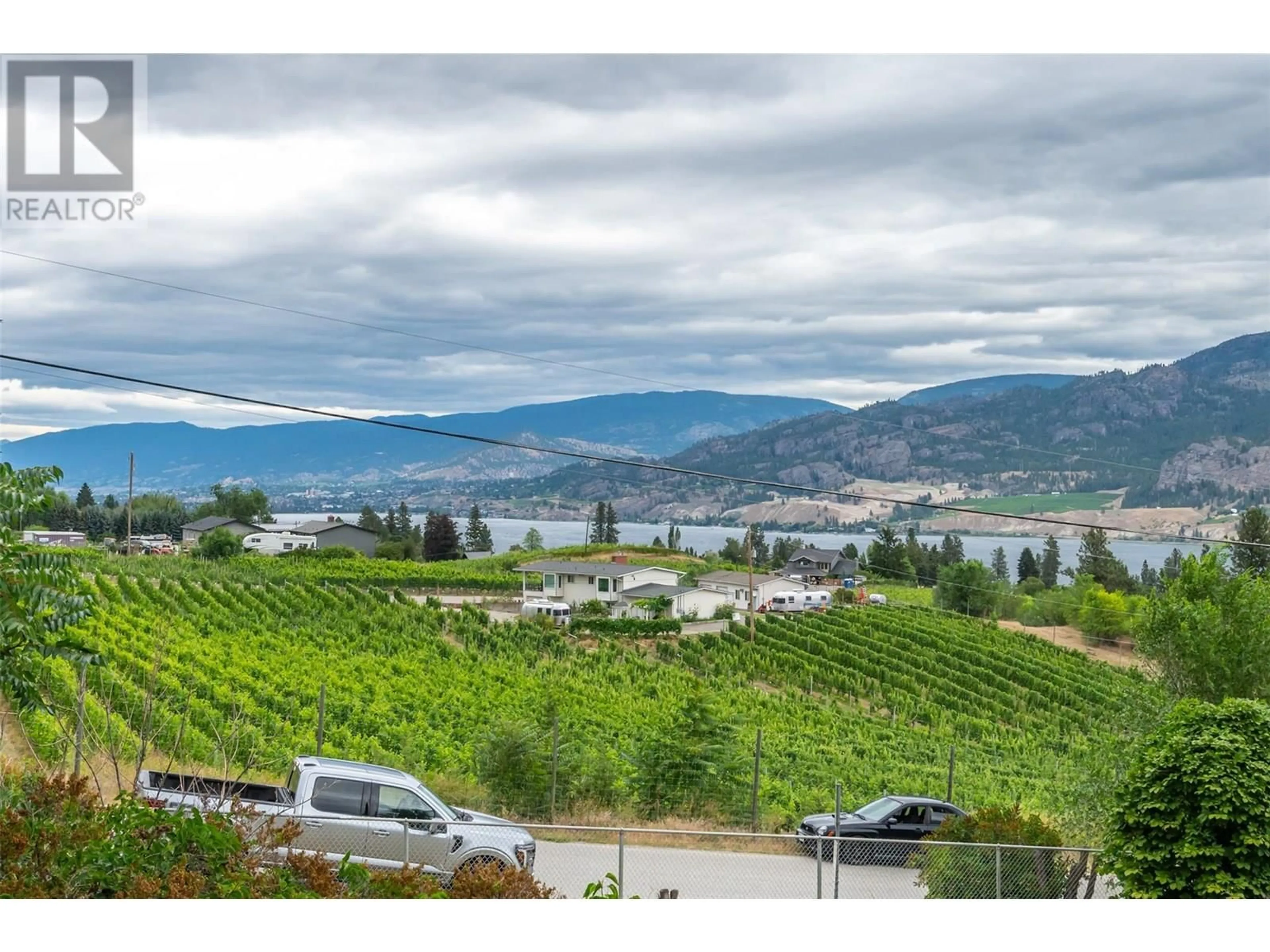A pic from outside/outdoor area/front of a property/back of a property/a pic from drone, water/lake/river/ocean view for 100 LARCH AVENUE, Kaleden British Columbia V0H1K0