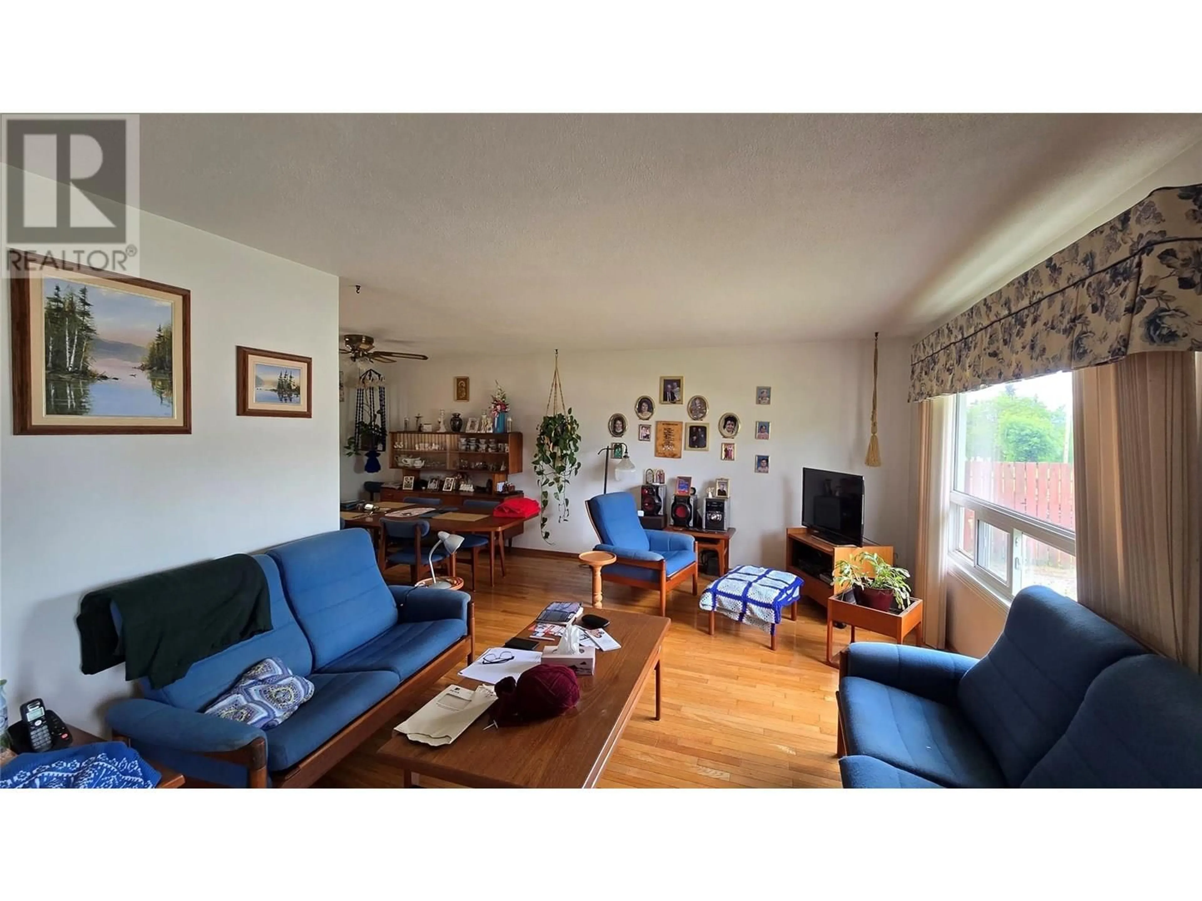 Living room with furniture, wood/laminate floor for 9016 LYMAN DRIVE, Dawson Creek British Columbia V1G3M9