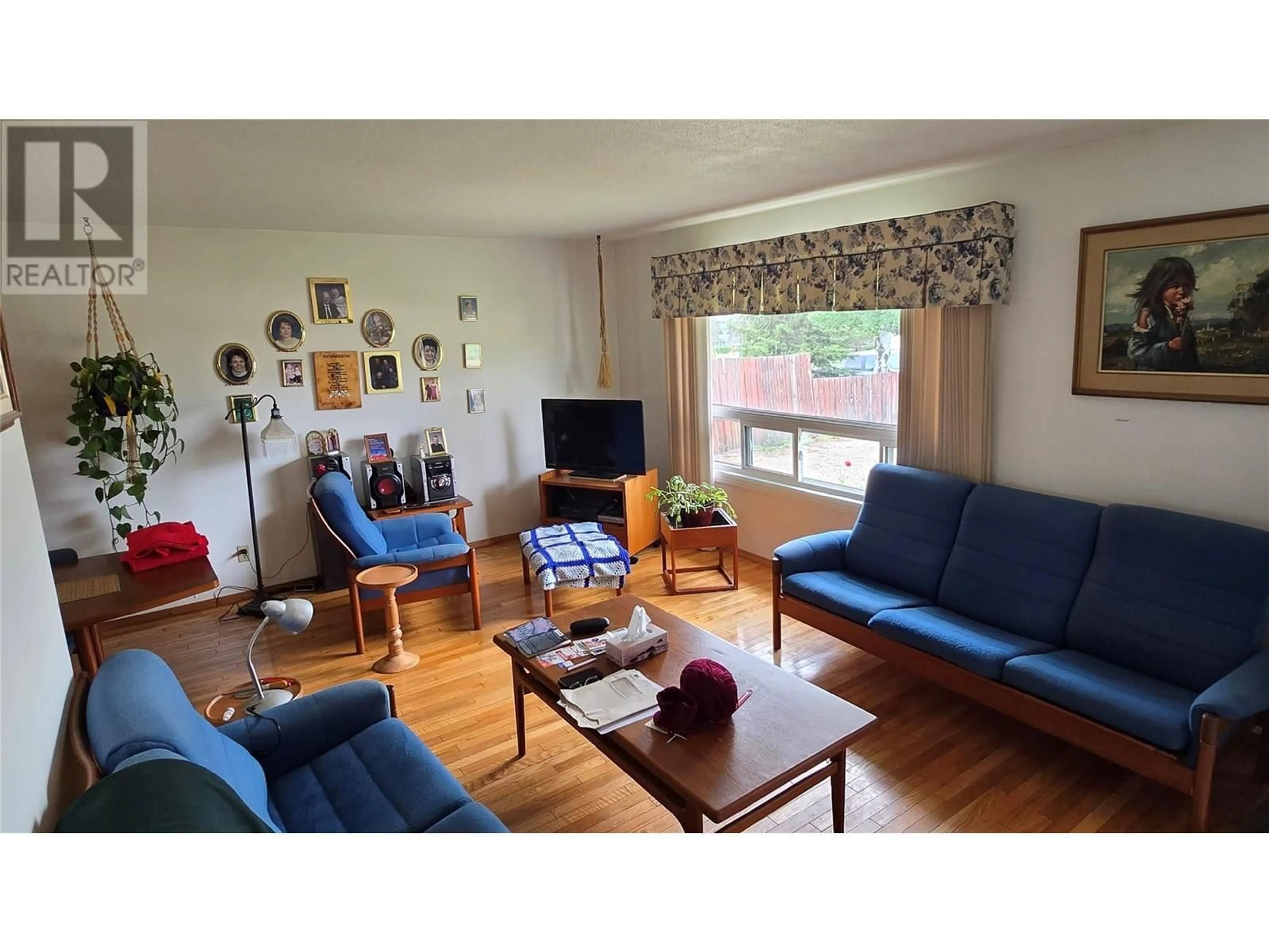 Living room with furniture, wood/laminate floor for 9016 LYMAN DRIVE, Dawson Creek British Columbia V1G3M9