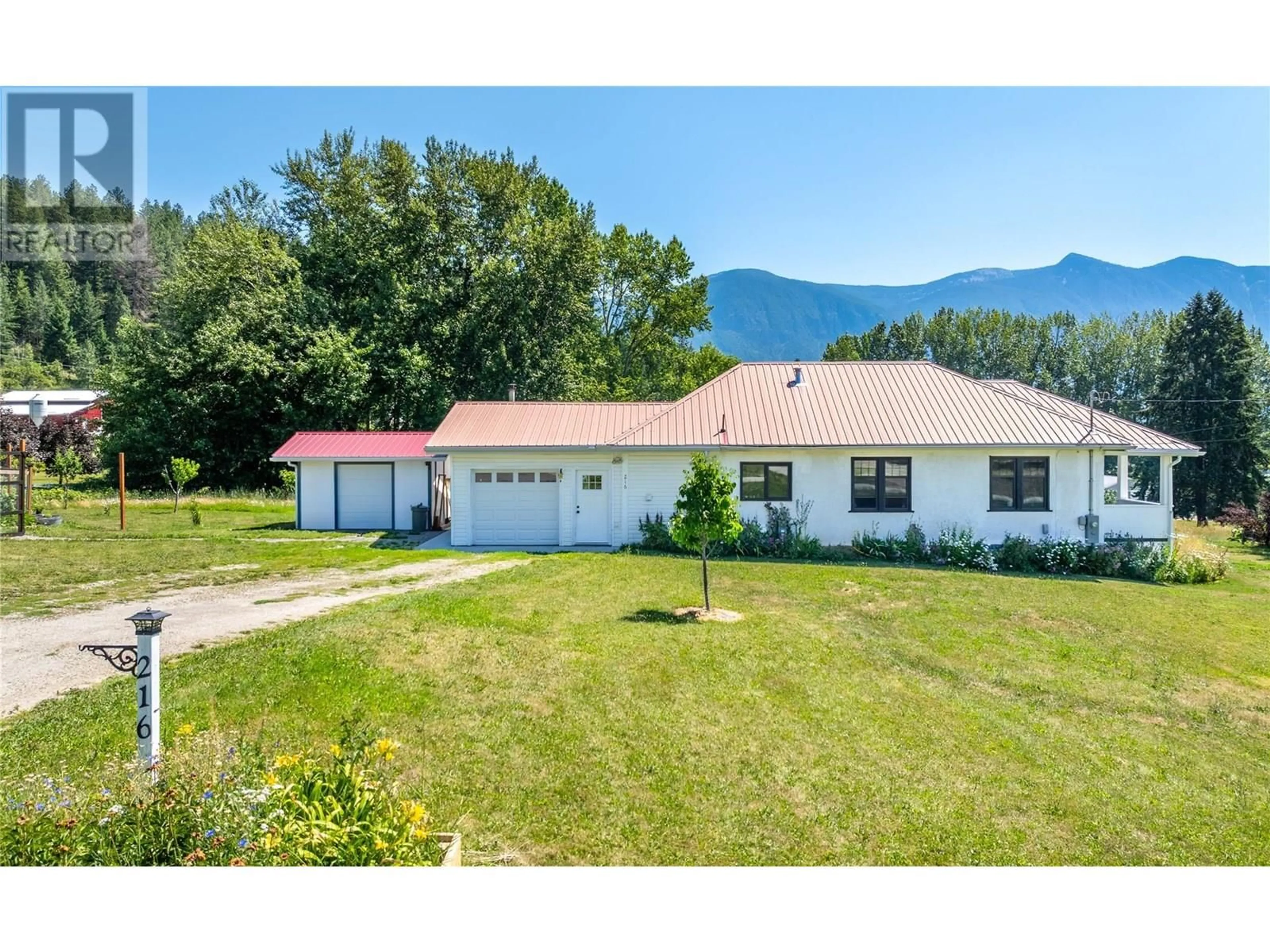 A pic from outside/outdoor area/front of a property/back of a property/a pic from drone, mountain view for 216 27TH AVENUE, Creston British Columbia V0B1G0