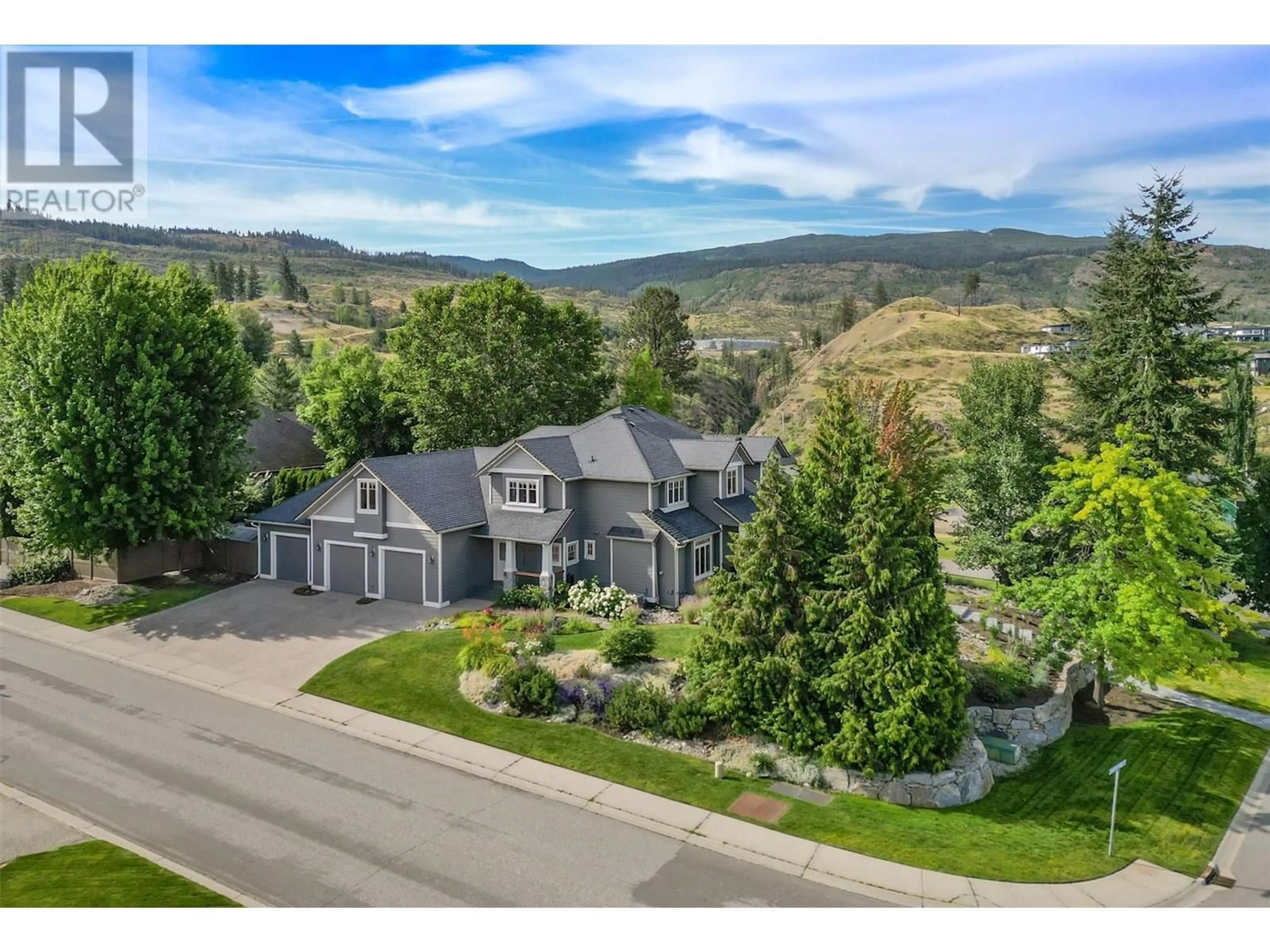 A pic from outside/outdoor area/front of a property/back of a property/a pic from drone, mountain view for 1717 CANYON VIEW COURT, Kelowna British Columbia V1W4A2
