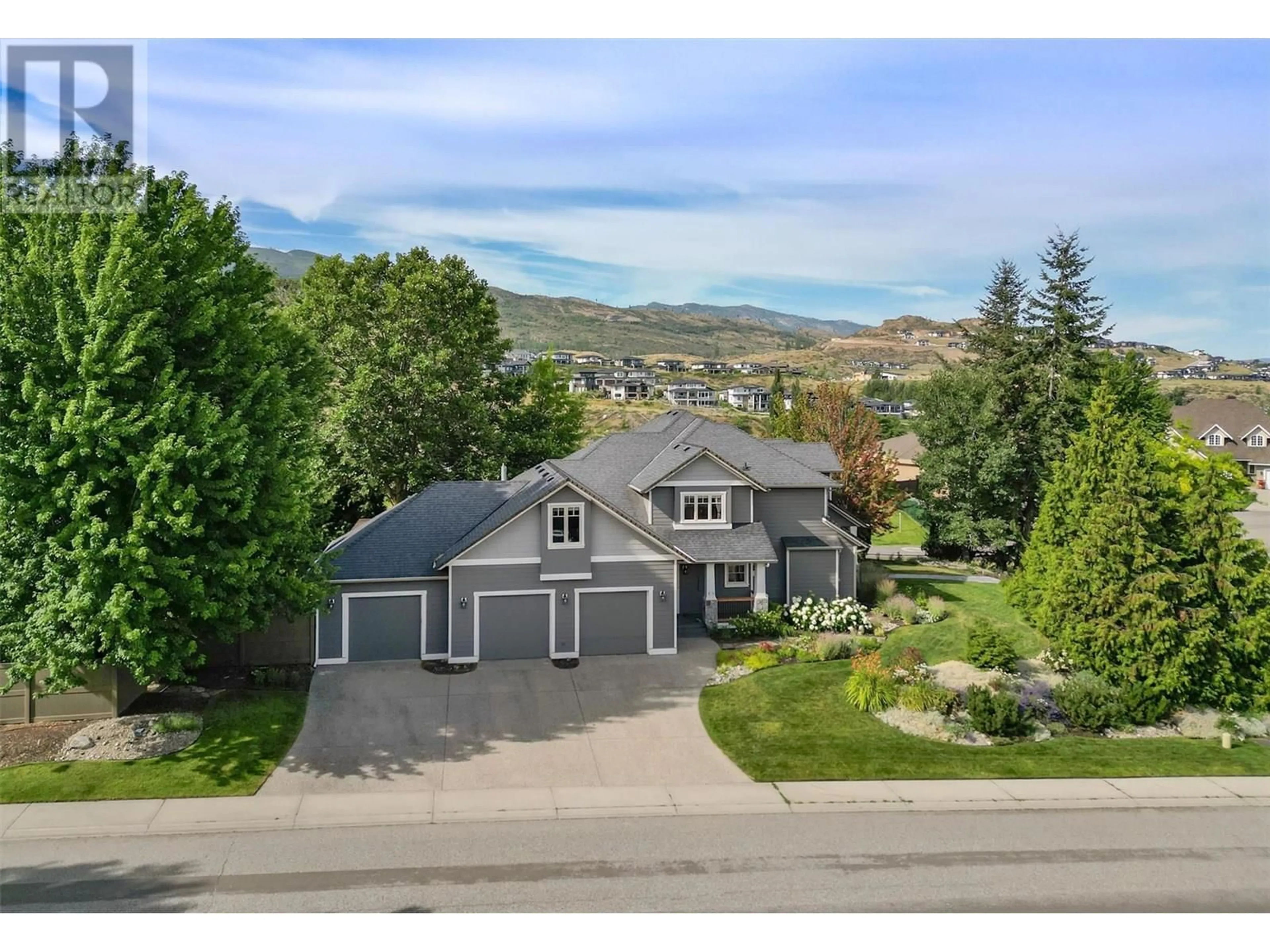A pic from outside/outdoor area/front of a property/back of a property/a pic from drone, mountain view for 1717 CANYON VIEW COURT, Kelowna British Columbia V1W4A2