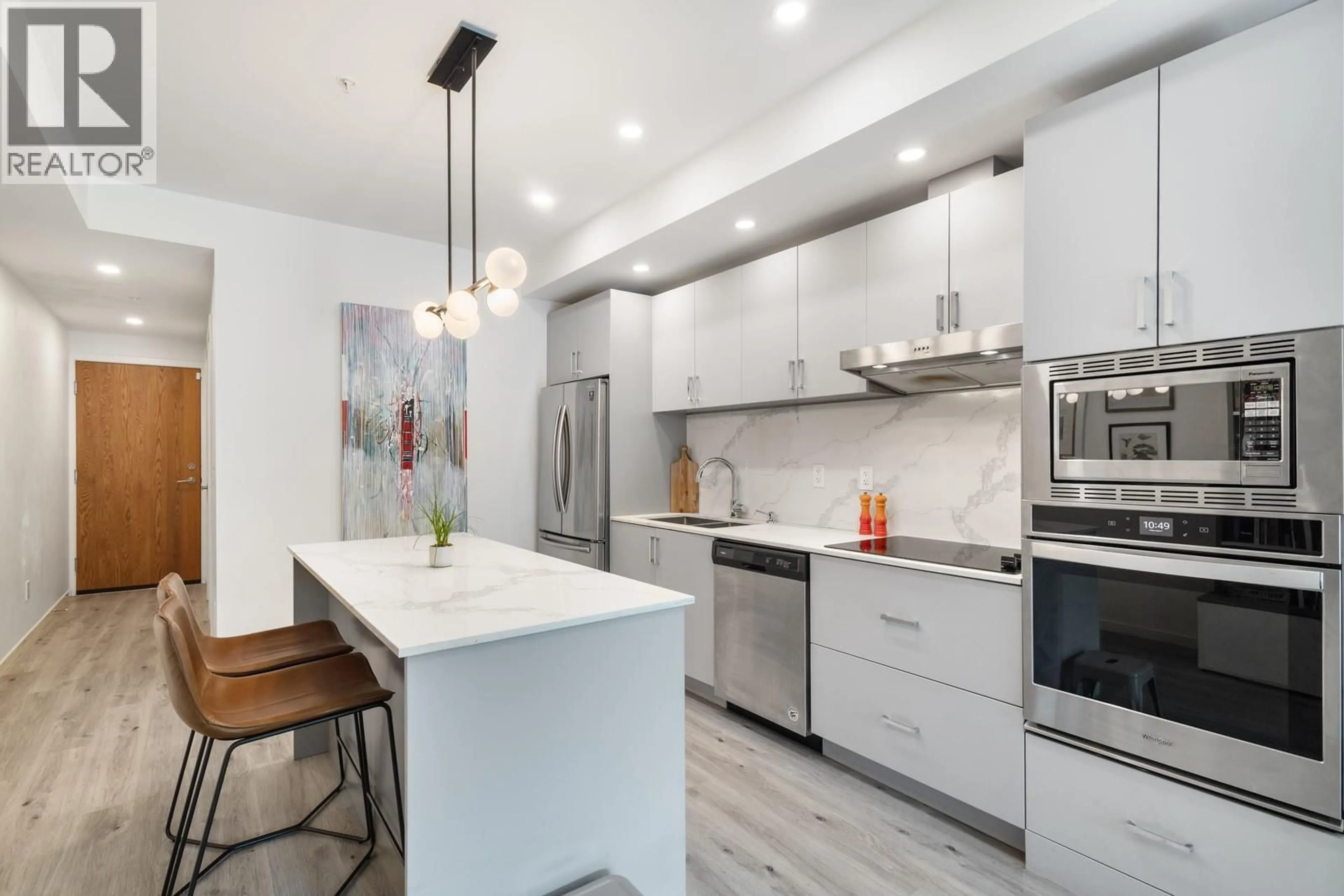 Contemporary kitchen, ceramic/tile floor for 108 - 880 SAUCIER AVENUE, Kelowna British Columbia V1Y2Y7