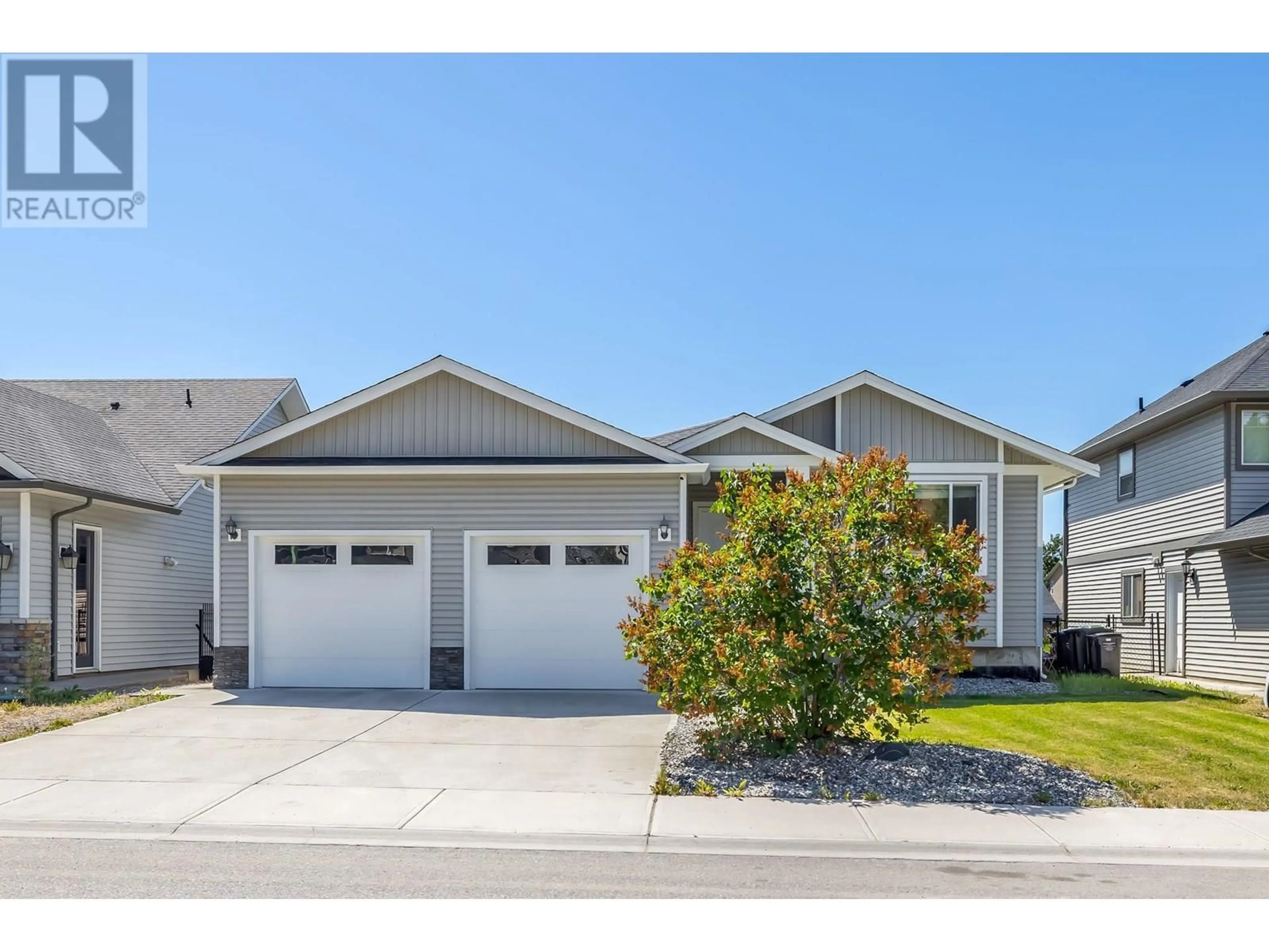 Home with vinyl exterior material, street for 335 ARAB ROAD, Kelowna British Columbia V1V3A8