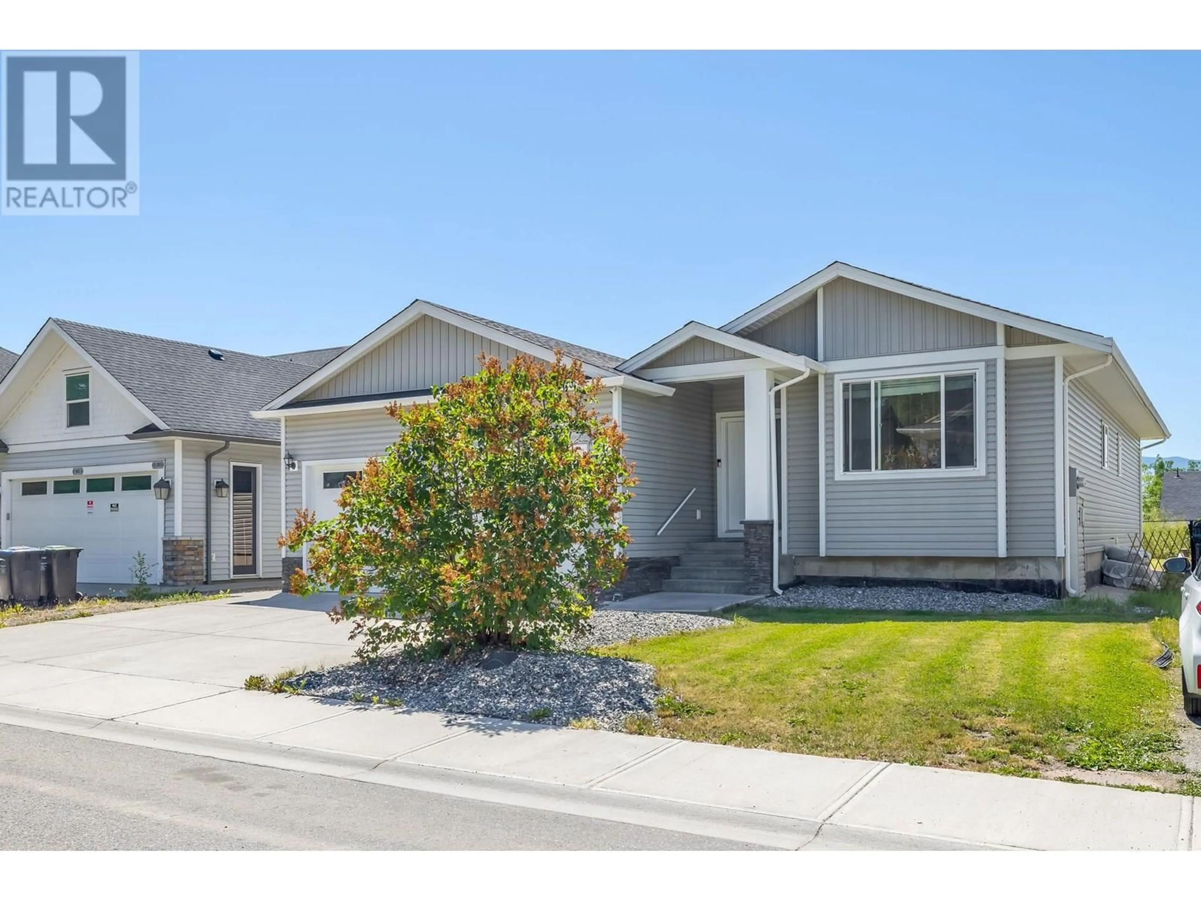 Home with vinyl exterior material, street for 335 ARAB ROAD, Kelowna British Columbia V1V3A8