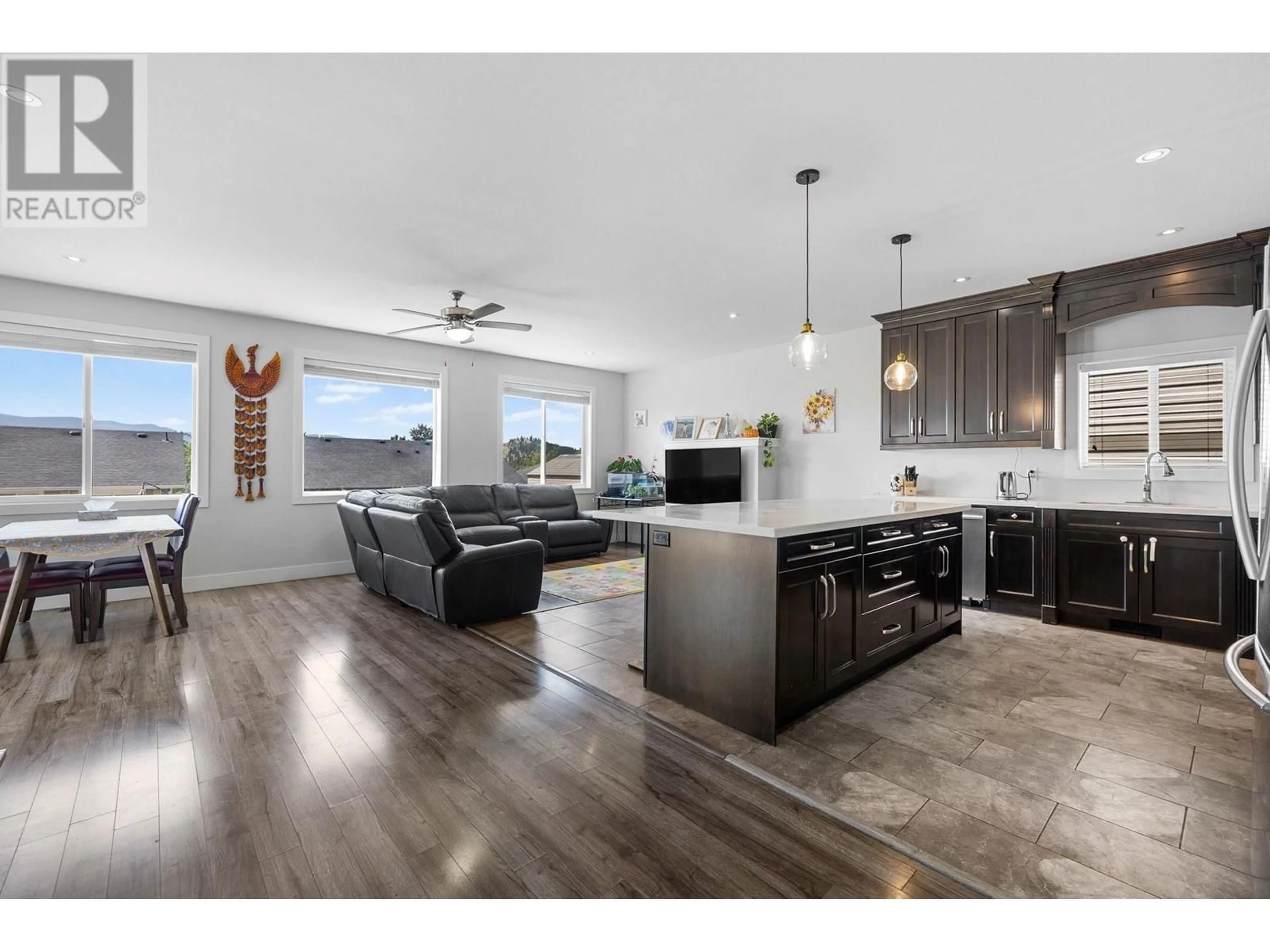 Open concept kitchen, wood/laminate floor for 335 ARAB ROAD, Kelowna British Columbia V1V3A8