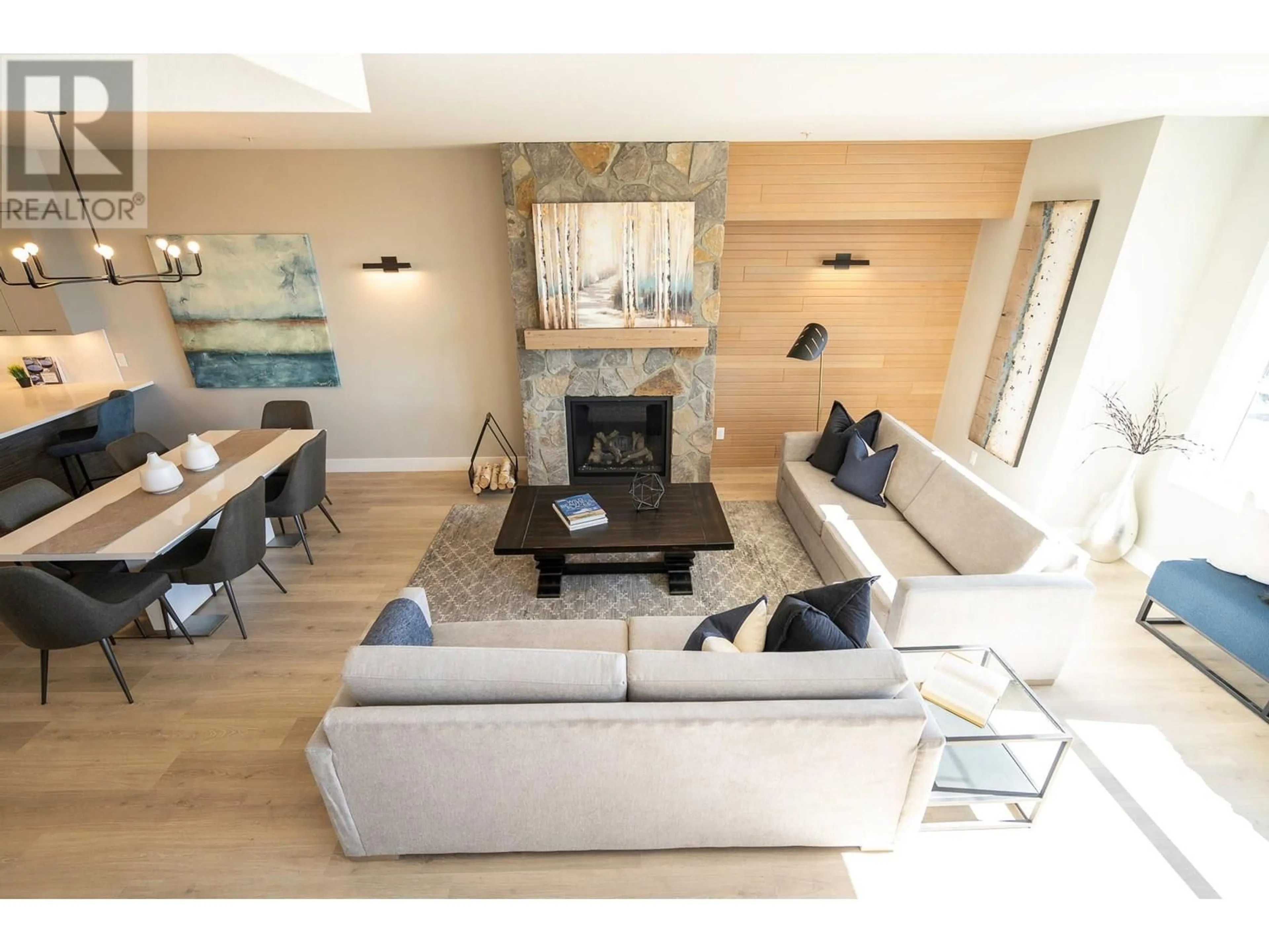 Living room with furniture, wood/laminate floor for 270B GRIZZLY RIDGE TRAIL, Big White British Columbia V1P1P4