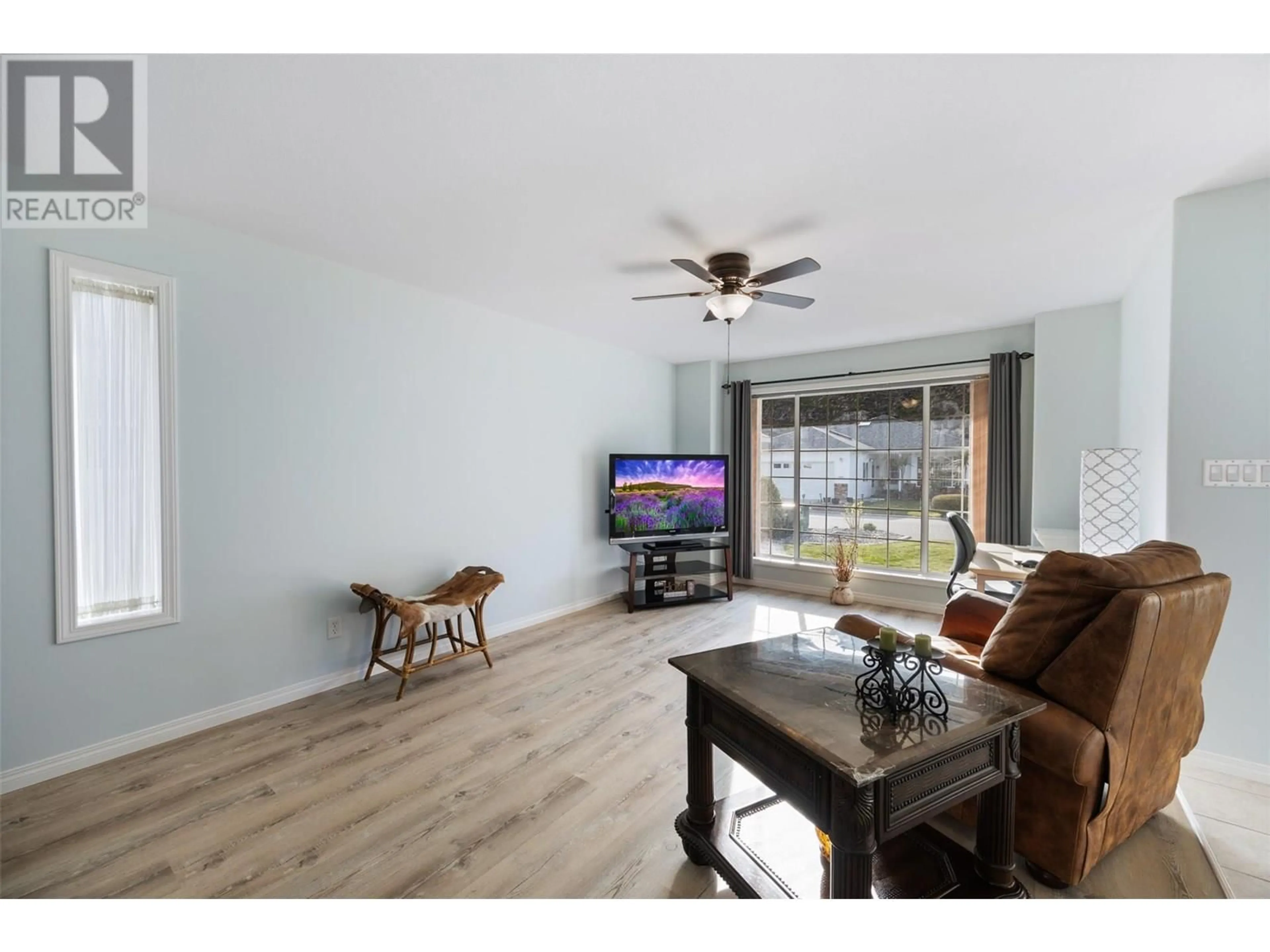 Living room with furniture, wood/laminate floor for 536 RED WING DRIVE, Penticton British Columbia V2A8N7