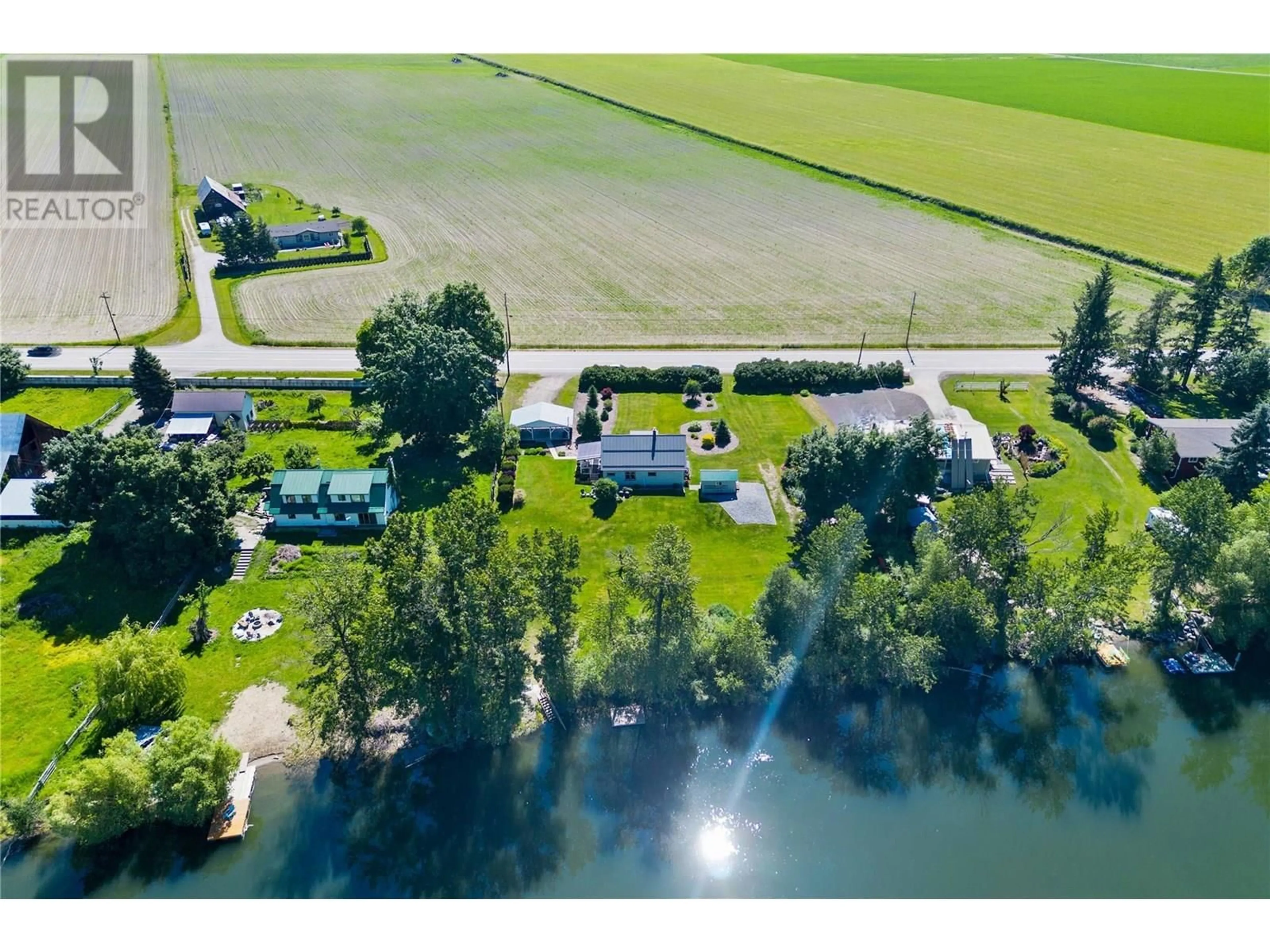 A pic from outside/outdoor area/front of a property/back of a property/a pic from drone, water/lake/river/ocean view for 7112 97A HIGHWAY, Grindrod British Columbia V0E1Y0