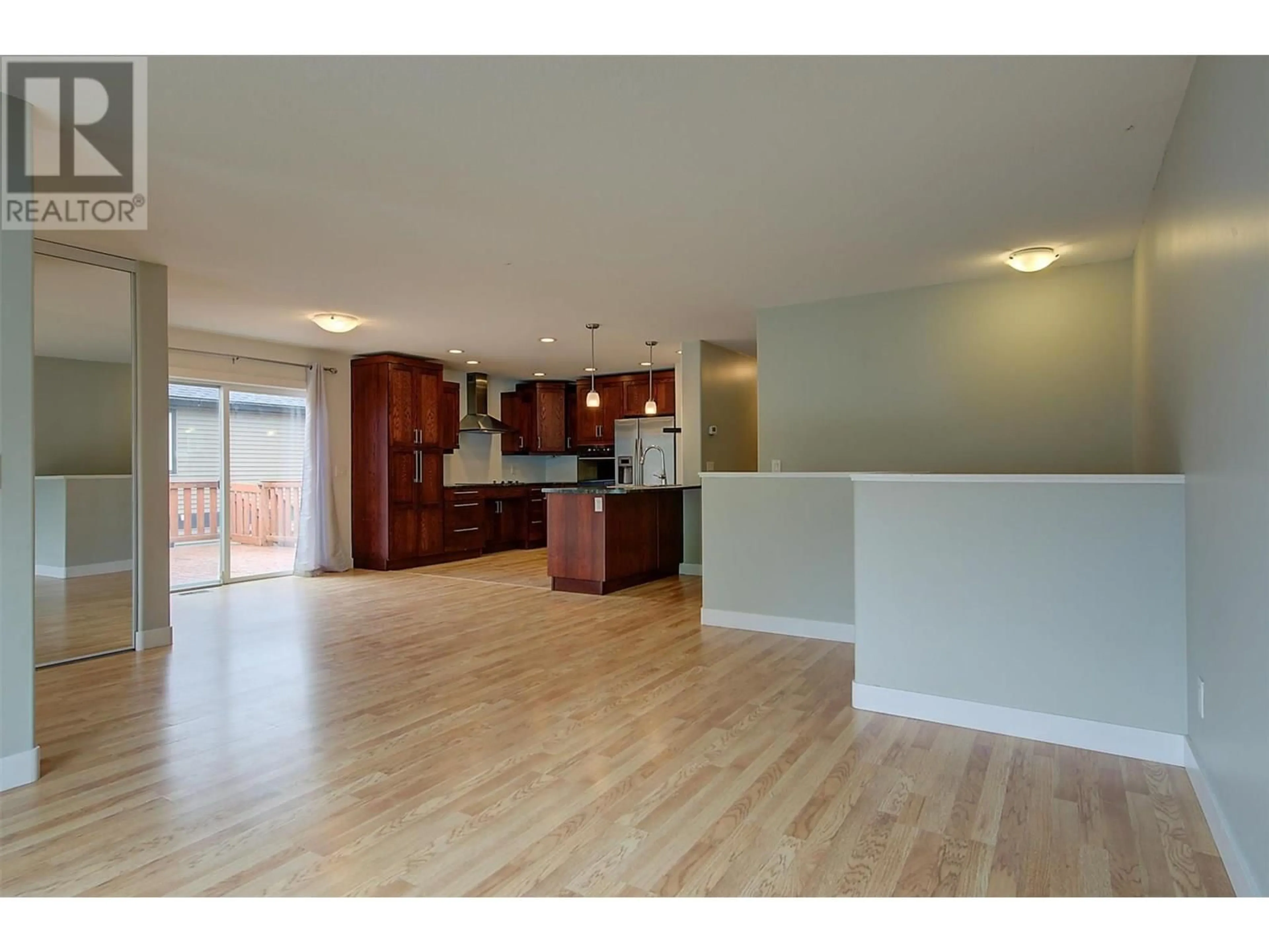 Open concept kitchen, wood/laminate floor for 319 ARAB ROAD, Kelowna British Columbia V1V3A8