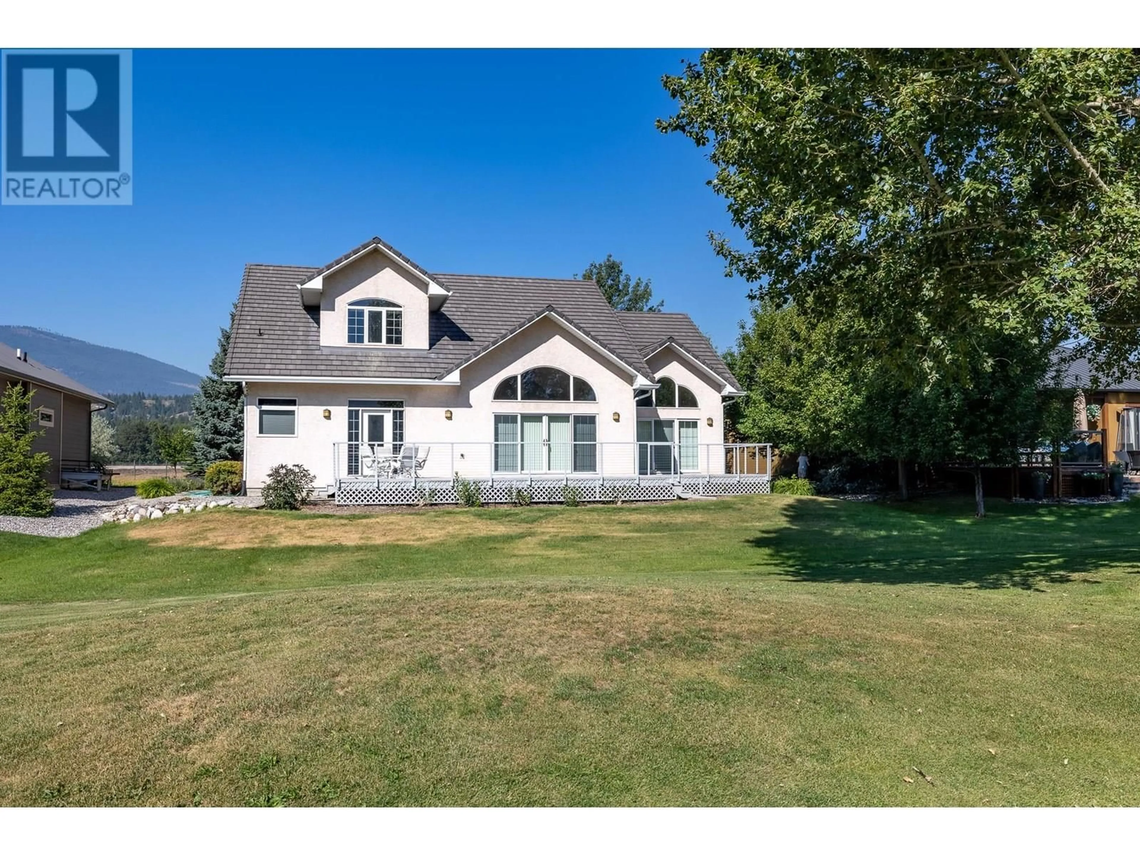 A pic from outside/outdoor area/front of a property/back of a property/a pic from drone, mountain view for 5214 RIVERSIDE DRIVE, Fairmont Hot Springs British Columbia V0B1L1