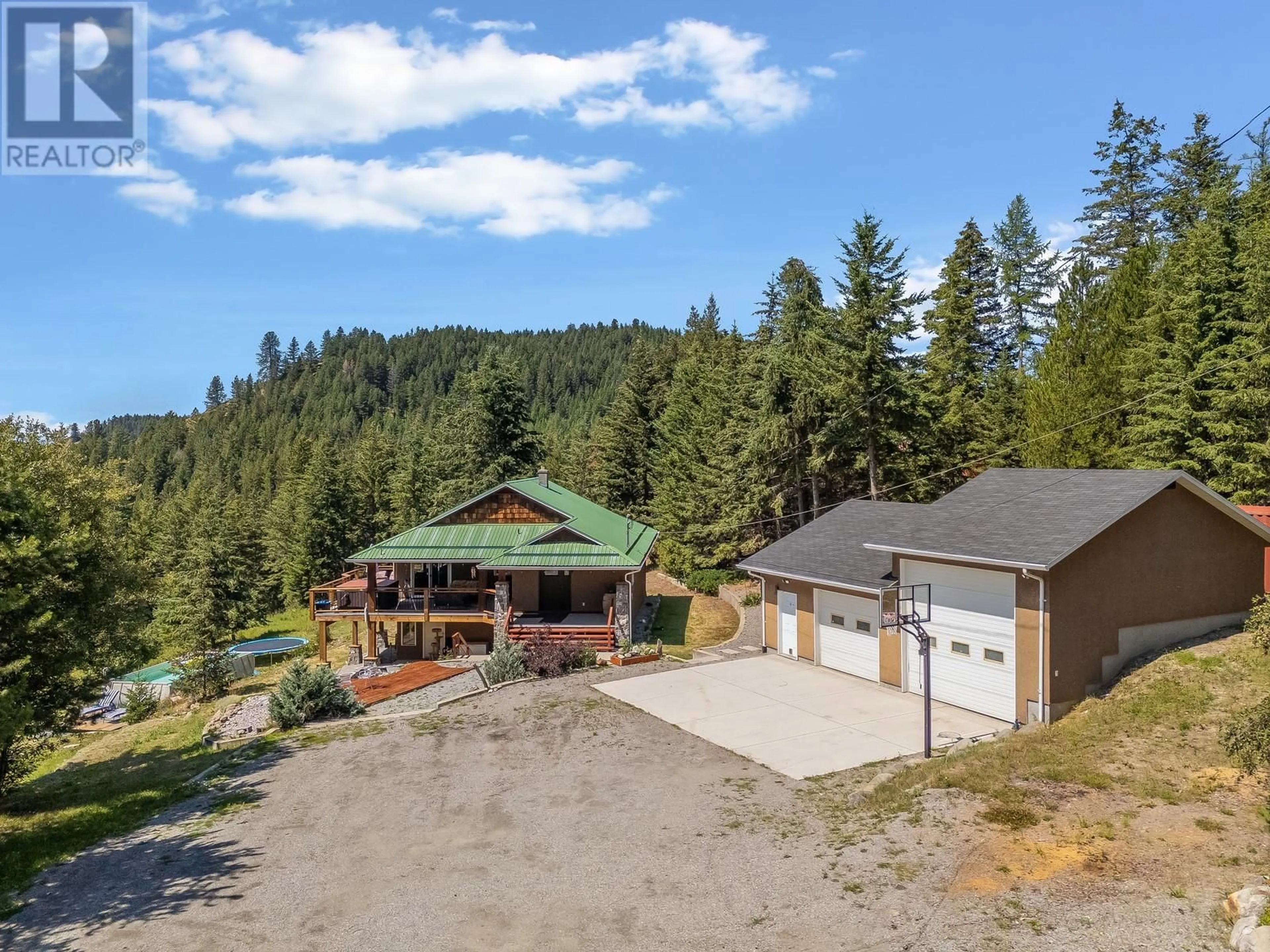A pic from outside/outdoor area/front of a property/back of a property/a pic from drone, unknown for 7575 SUN VALLEY ROAD, Kelowna British Columbia V1P1H4