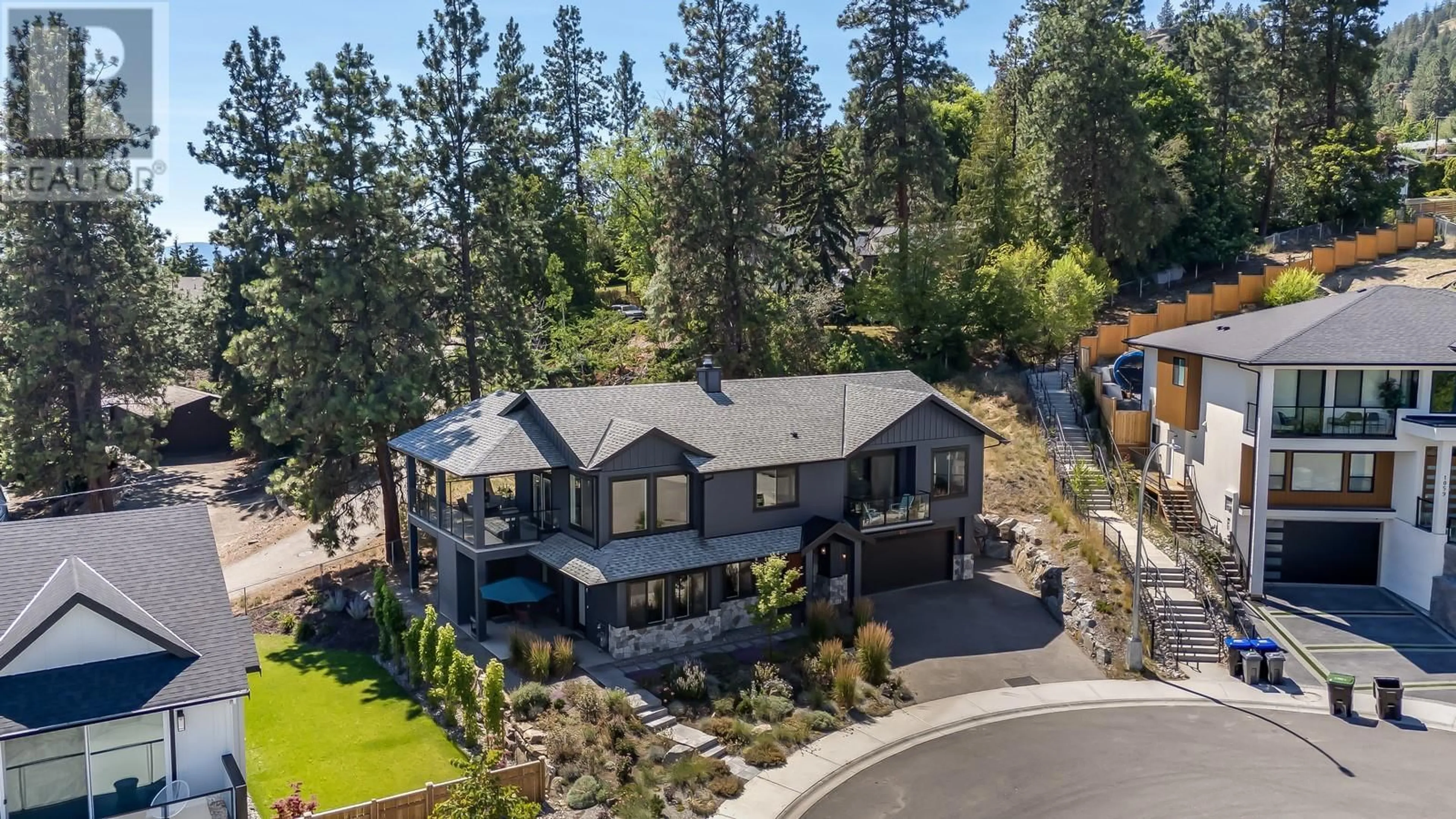 A pic from outside/outdoor area/front of a property/back of a property/a pic from drone, mountain view for 1055 OAK BARREL PLACE, West Kelowna British Columbia V1Z0A6