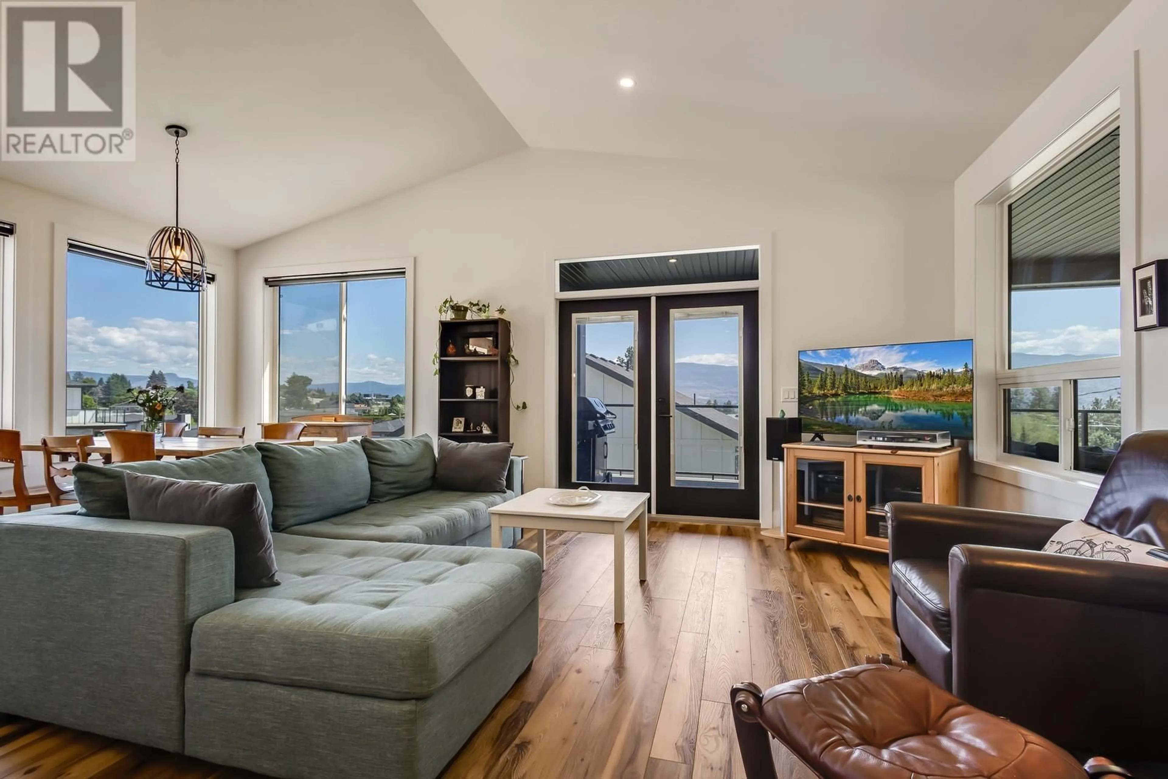 Living room with furniture, wood/laminate floor for 1055 OAK BARREL PLACE, West Kelowna British Columbia V1Z0A6