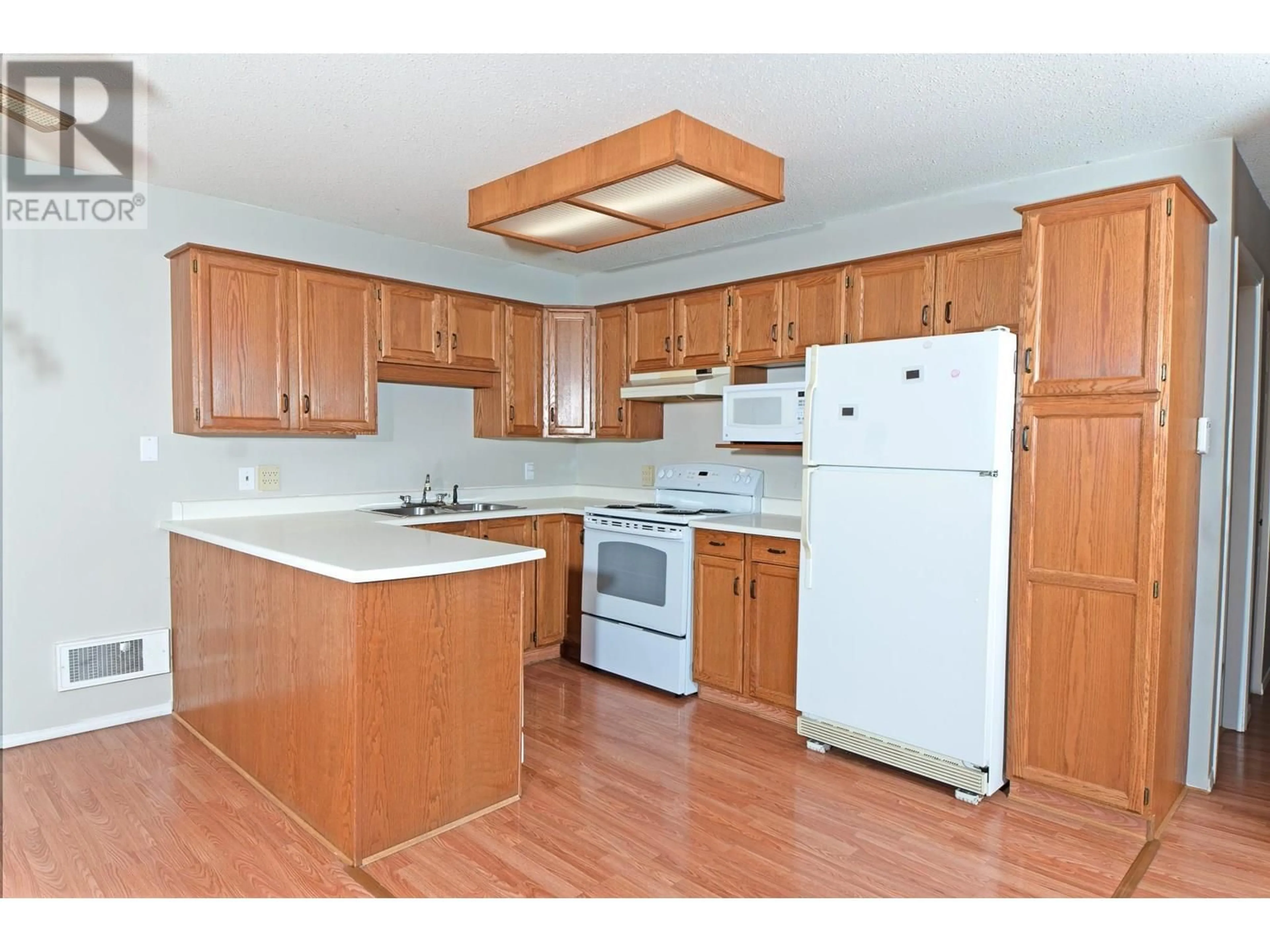 Standard kitchen, wood/laminate floor for 7 - 1907 PINE STREET, Creston British Columbia V0B1G5