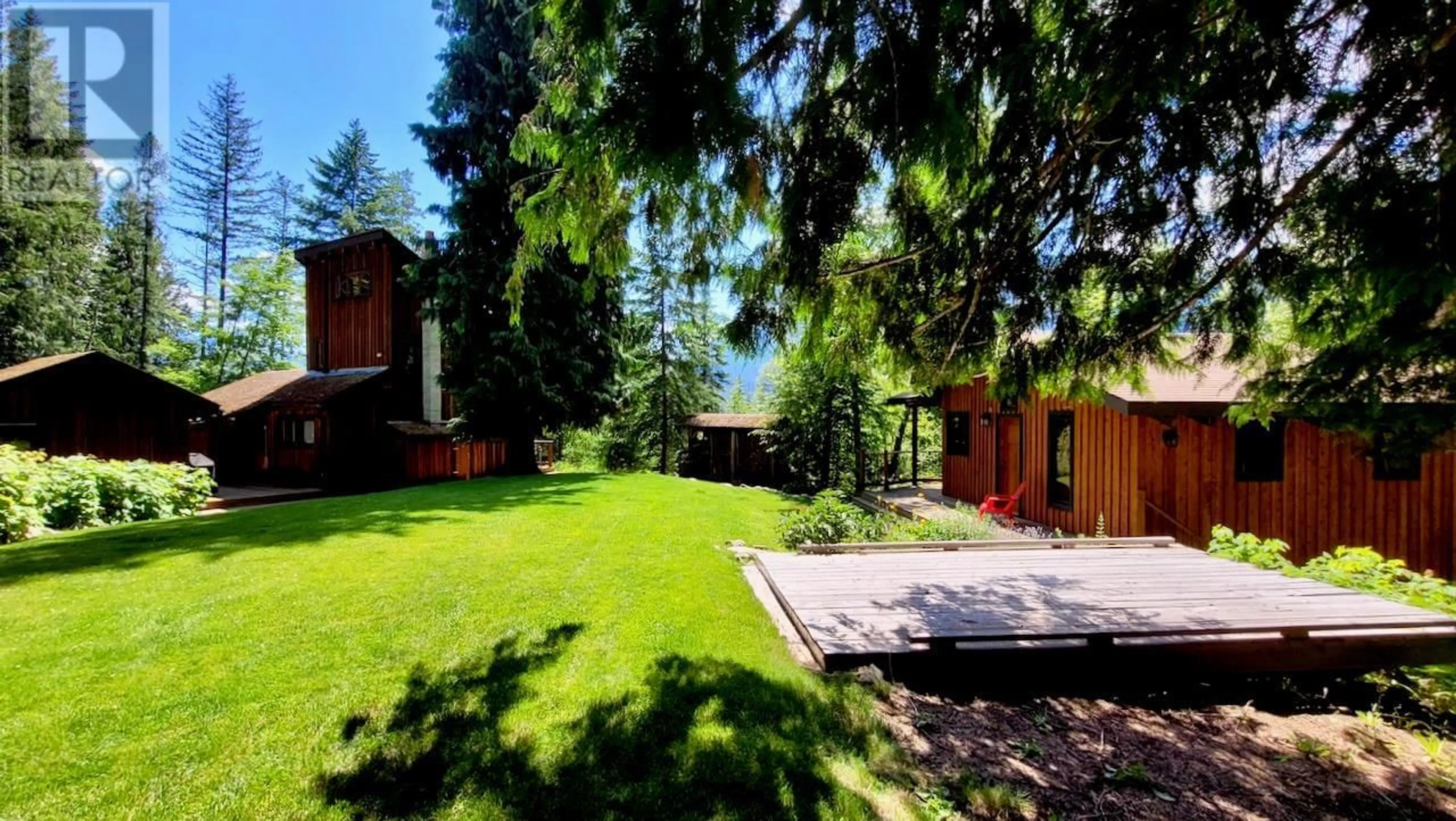 A pic from outside/outdoor area/front of a property/back of a property/a pic from drone, forest/trees view for 6306 HIGHWAY 6 HIGHWAY, New Denver British Columbia V0G1S1