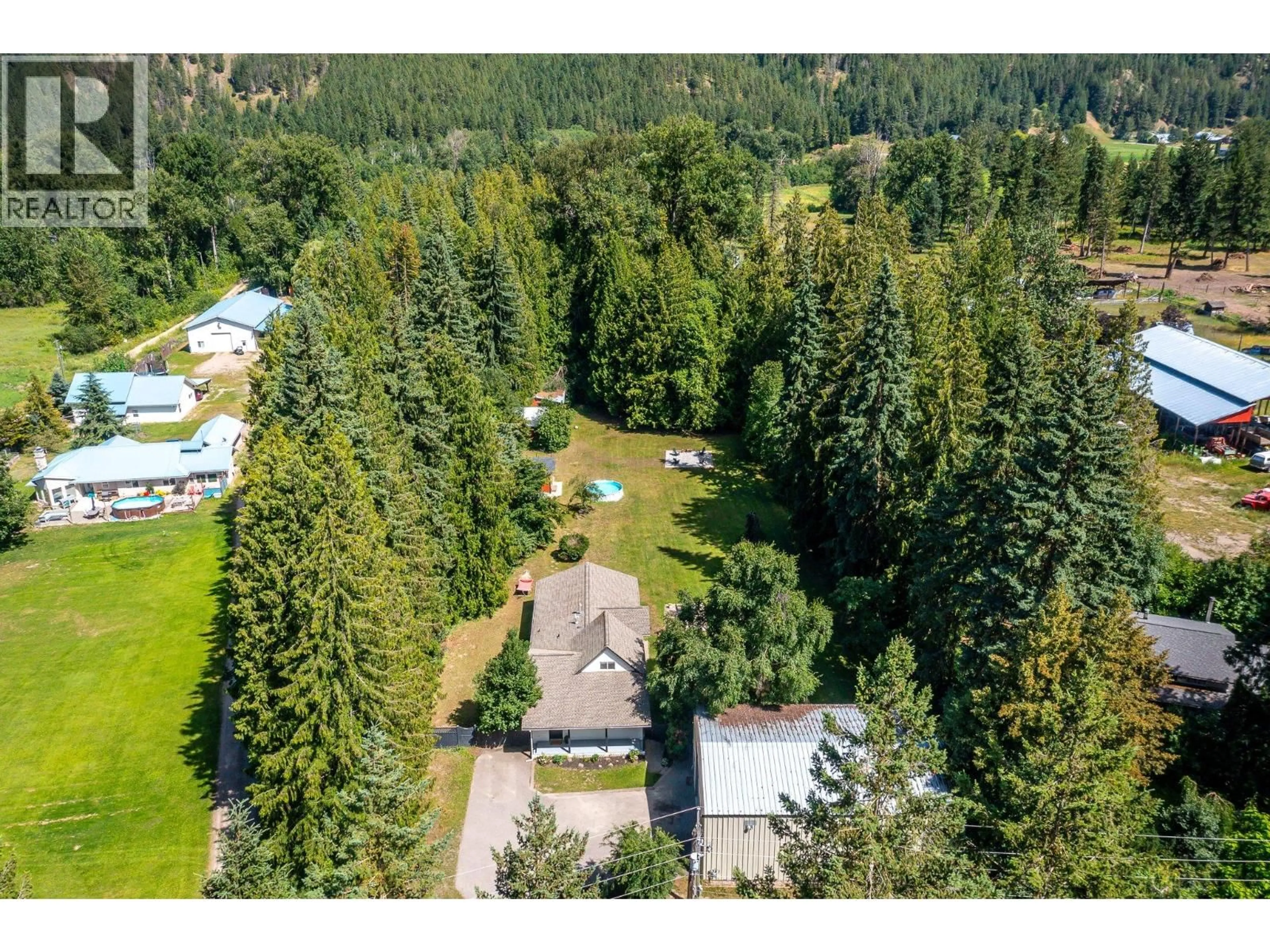 A pic from outside/outdoor area/front of a property/back of a property/a pic from drone, forest/trees view for 855 SALMON RIVER ROAD, Salmon Arm British Columbia V1E3G3