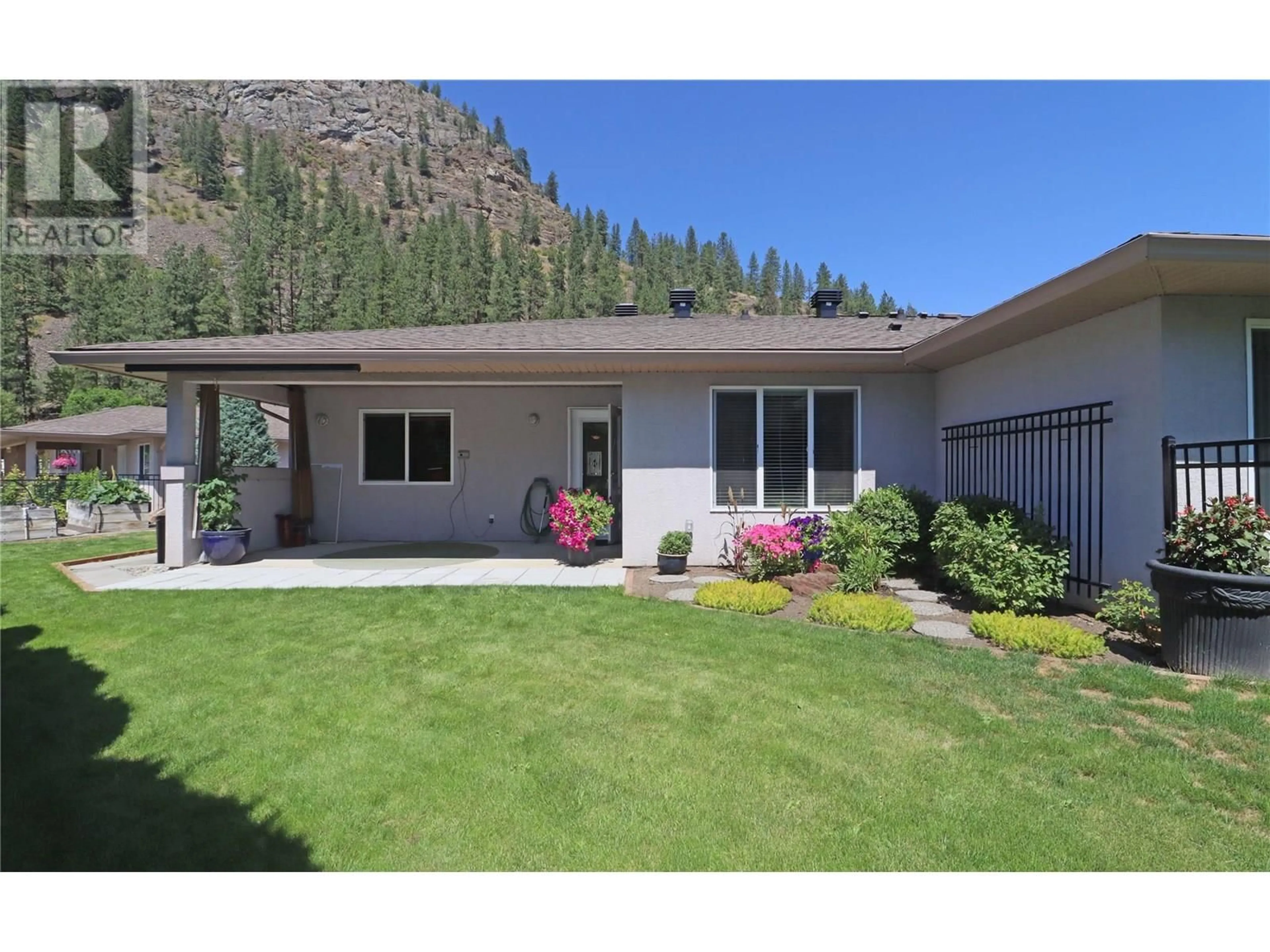 Home with vinyl exterior material, mountain view for 14 - 707 76TH AVENUE, Grand Forks British Columbia V0H1H0