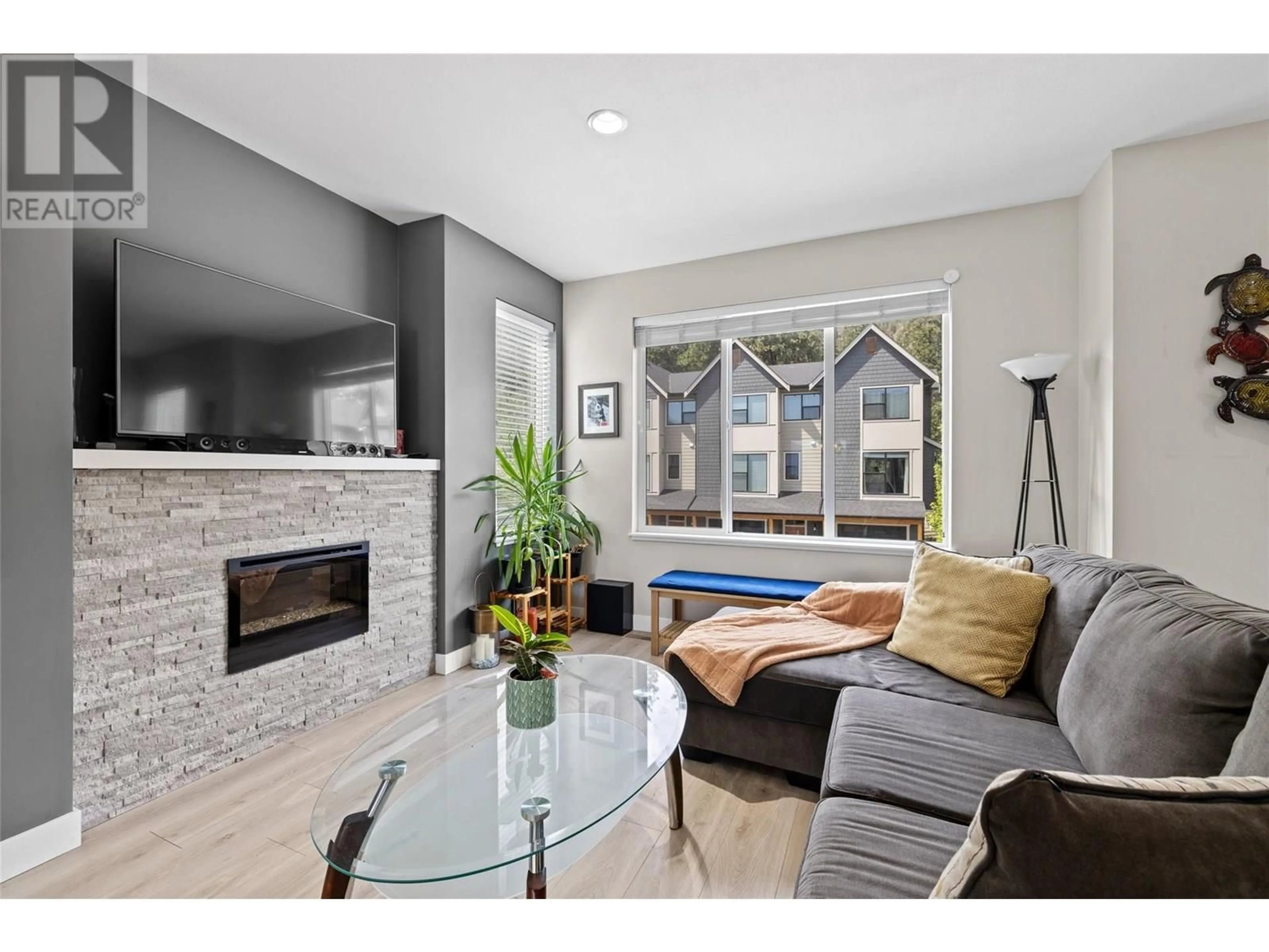 Living room with furniture, ceramic/tile floor for 61 - 2490 TUSCANY DRIVE, West Kelowna British Columbia V1T3M4