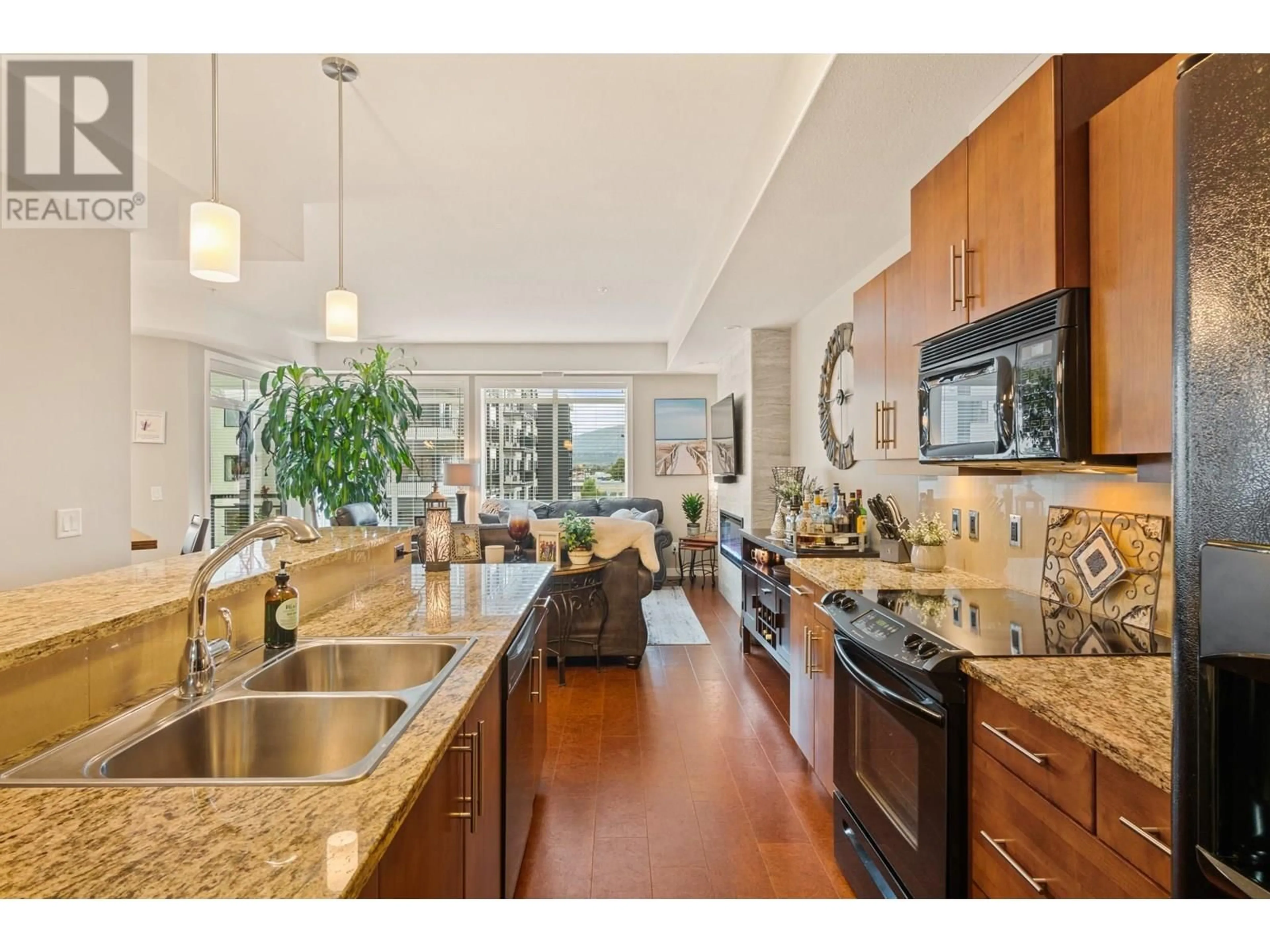 Open concept kitchen, ceramic/tile floor for 302 - 1933 AMBROSI ROAD, Kelowna British Columbia V1Y4S1