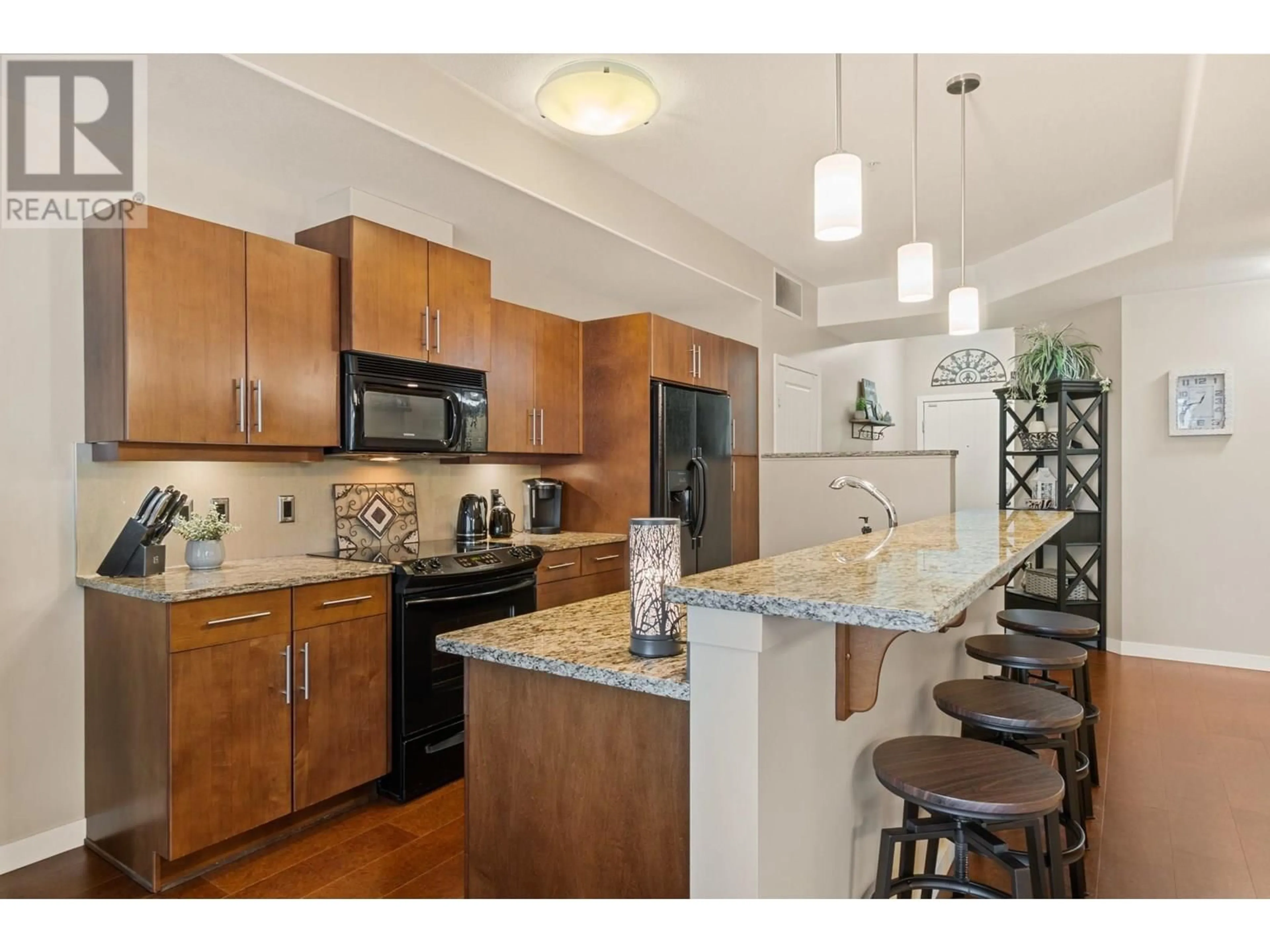 Open concept kitchen, unknown for 302 - 1933 AMBROSI ROAD, Kelowna British Columbia V1Y4S1