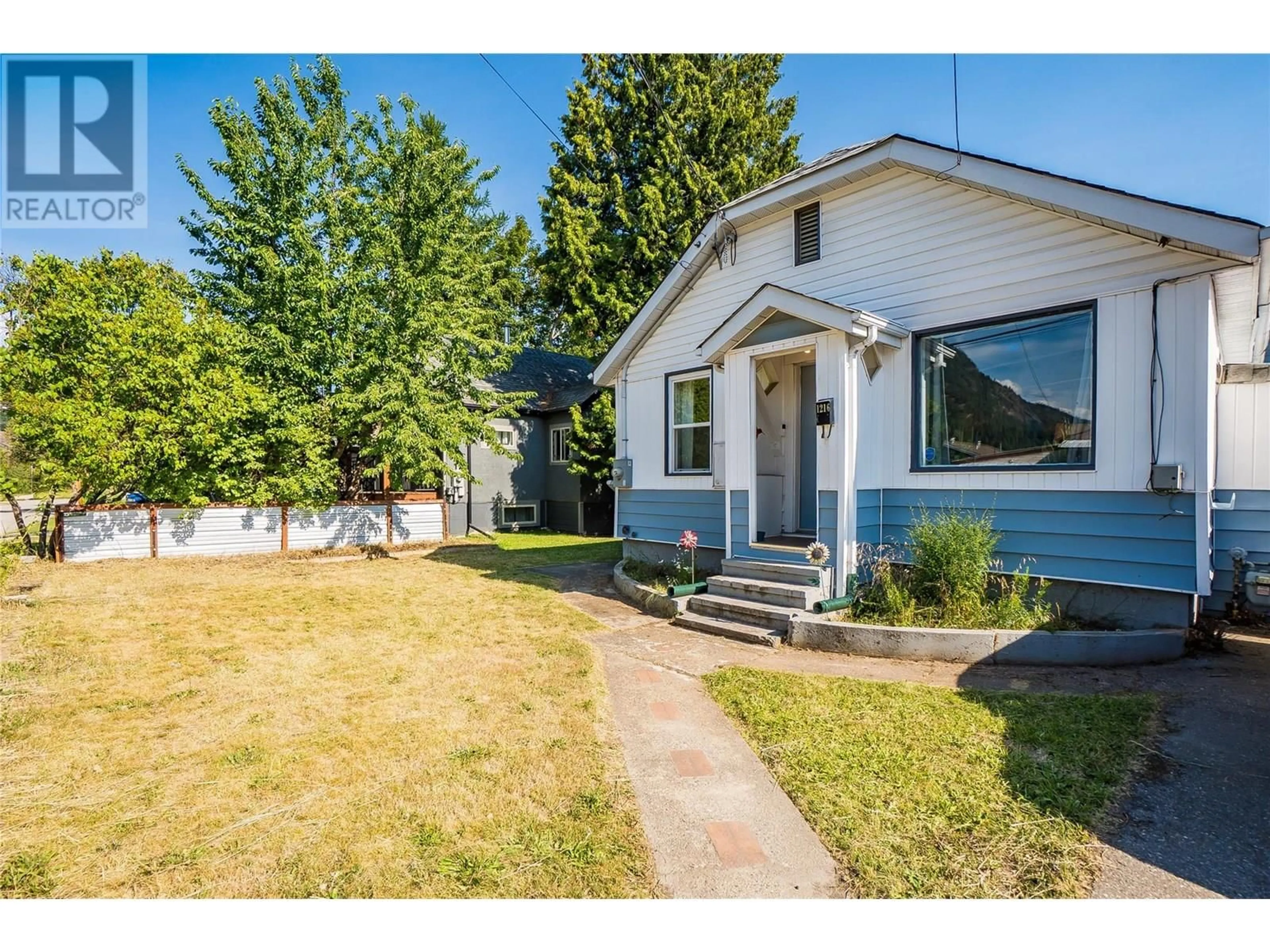 Home with vinyl exterior material, street for 1216 1ST STREET, Castlegar British Columbia V1N1A2