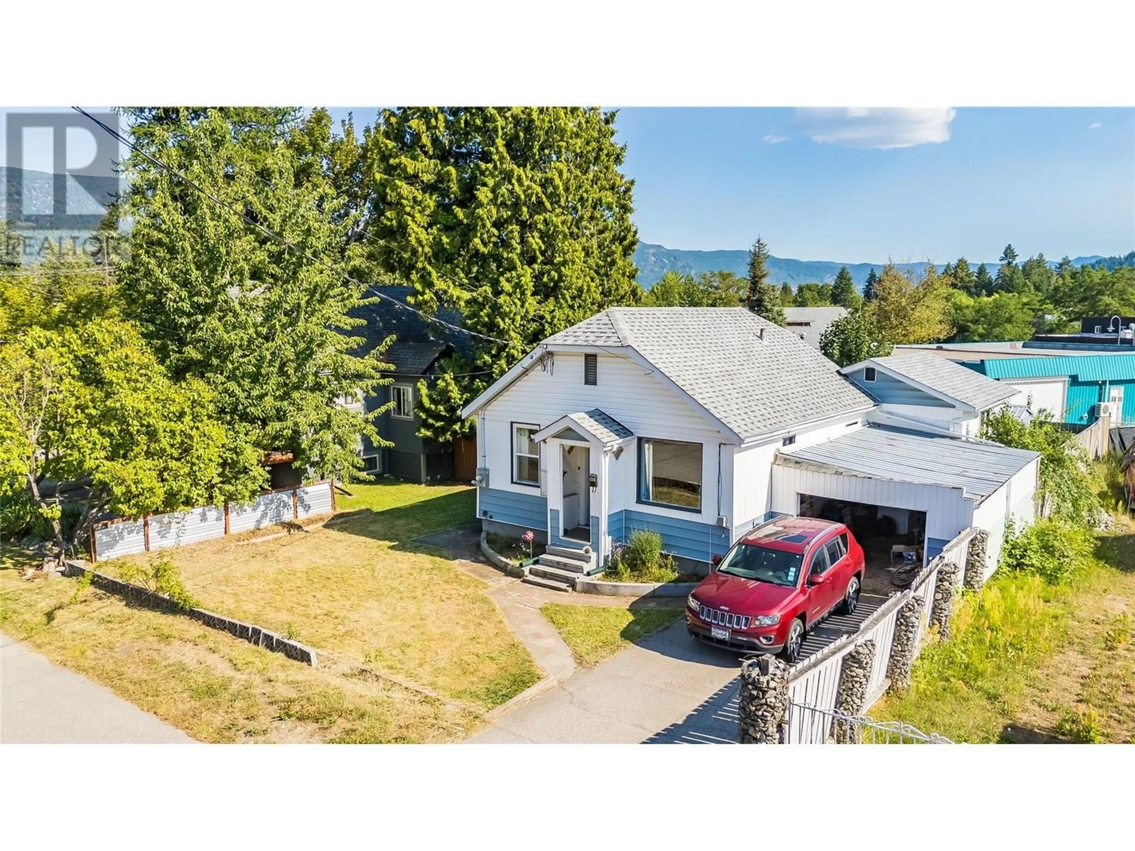 A pic from outside/outdoor area/front of a property/back of a property/a pic from drone, street for 1216 1ST STREET, Castlegar British Columbia V1N1A2