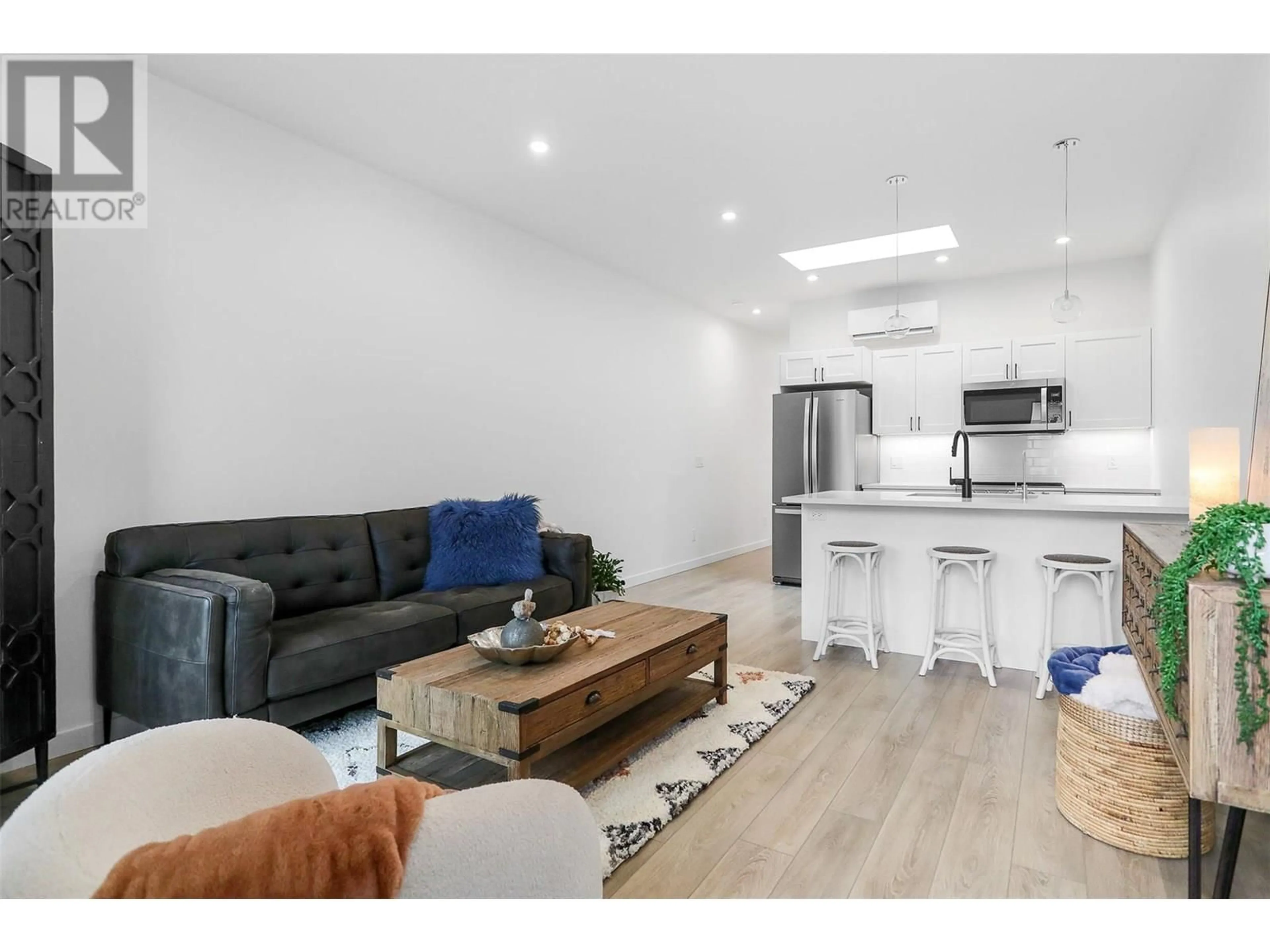 Open concept kitchen, wood/laminate floor for 219c - 8900 JIM BAILEY ROAD, Kelowna British Columbia V4V1E5