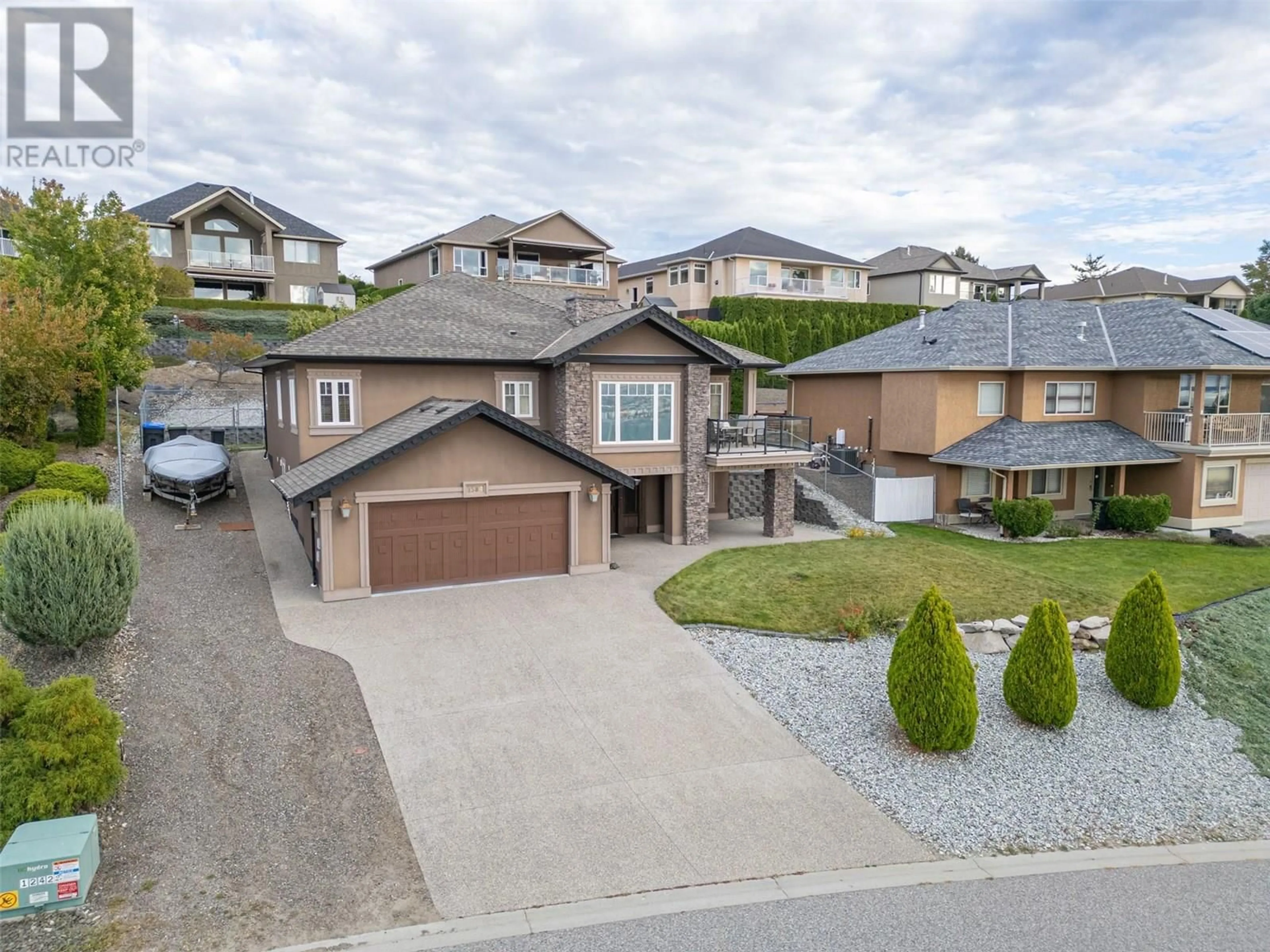 A pic from outside/outdoor area/front of a property/back of a property/a pic from drone, street for 1584 MERLOT DRIVE, West Kelowna British Columbia V1Y6G1