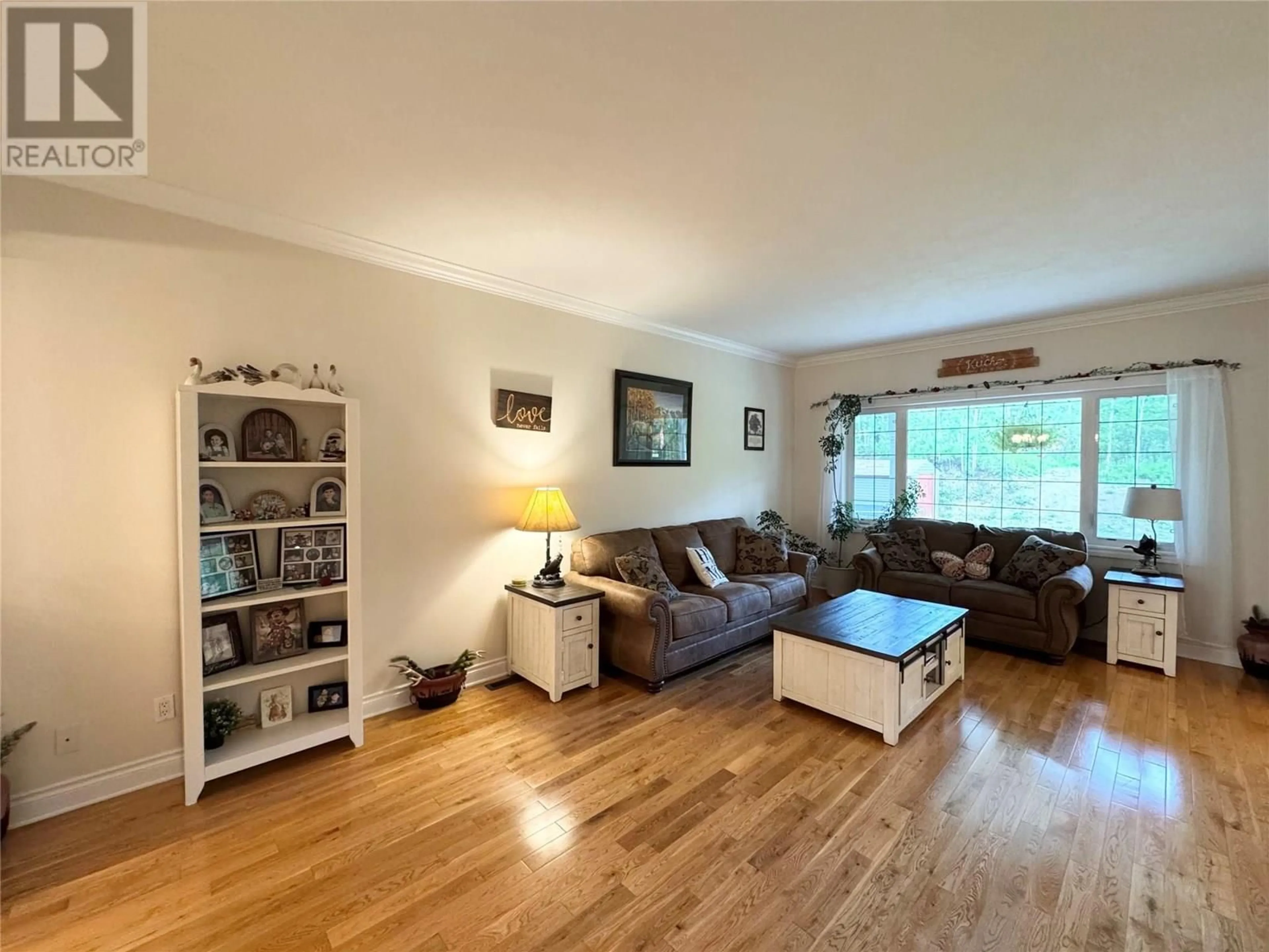 Living room with furniture, wood/laminate floor for 263 192 ROAD, Dawson Creek British Columbia V1G2L0